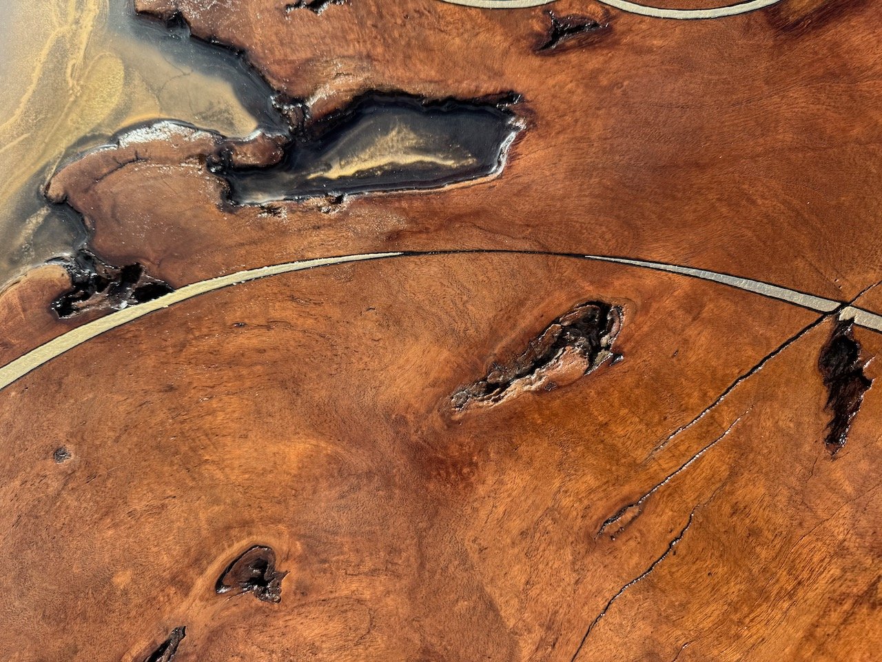Hand-polished resin surface highlighting the interplay of fire, pigment, and texture in Anne Shackelford’s Islands in the Sun.