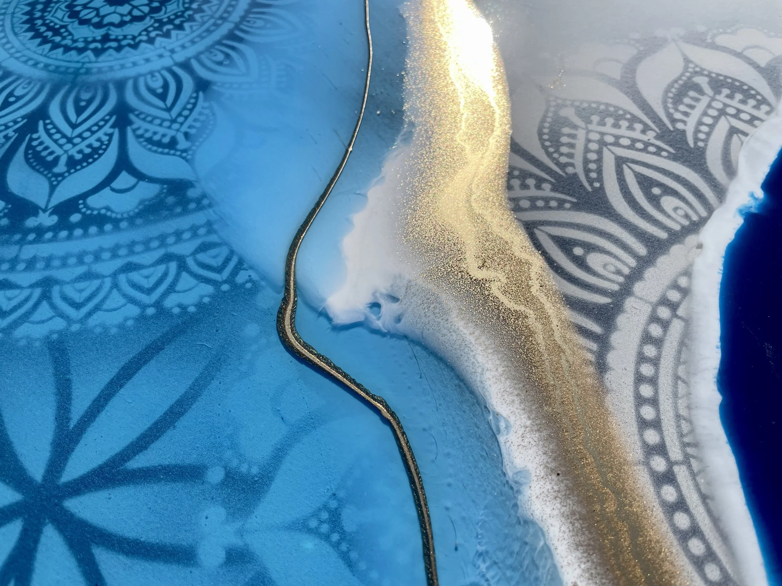 Hand painted interior door art featuring geometric pattern and layered mixed media