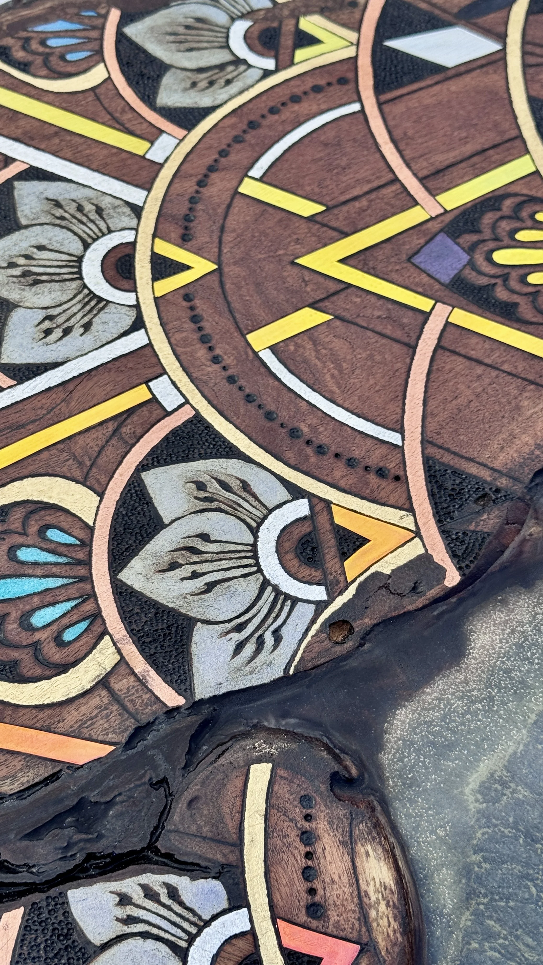 Mixed media detail of Alchemy of Becoming featuring pyrography, reflective materials, and intricate mandala patterning.
