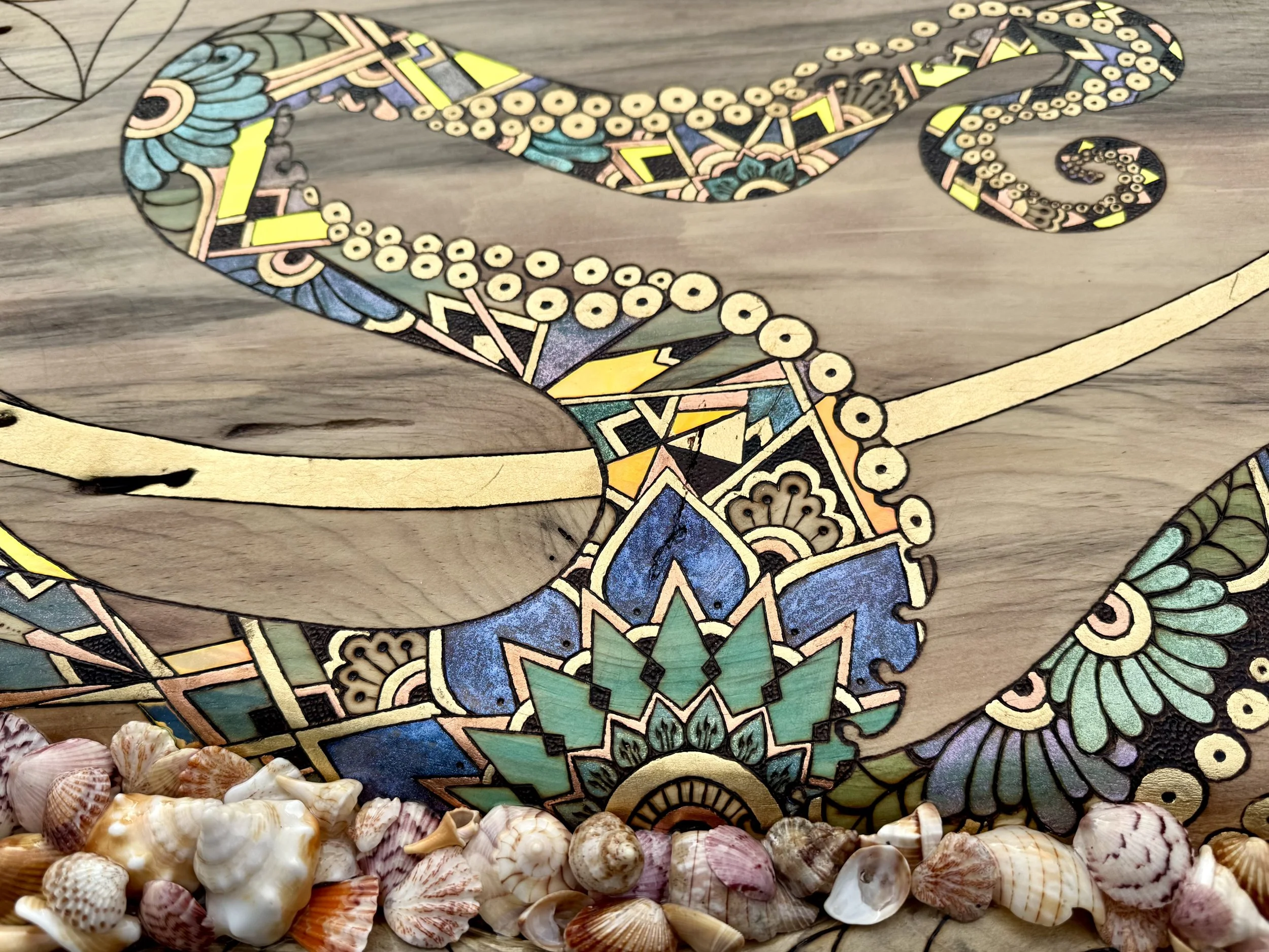 A kaleidoscopic fusion of ink, shimmer, and geometric accents animating a cephalopod-inspired design.