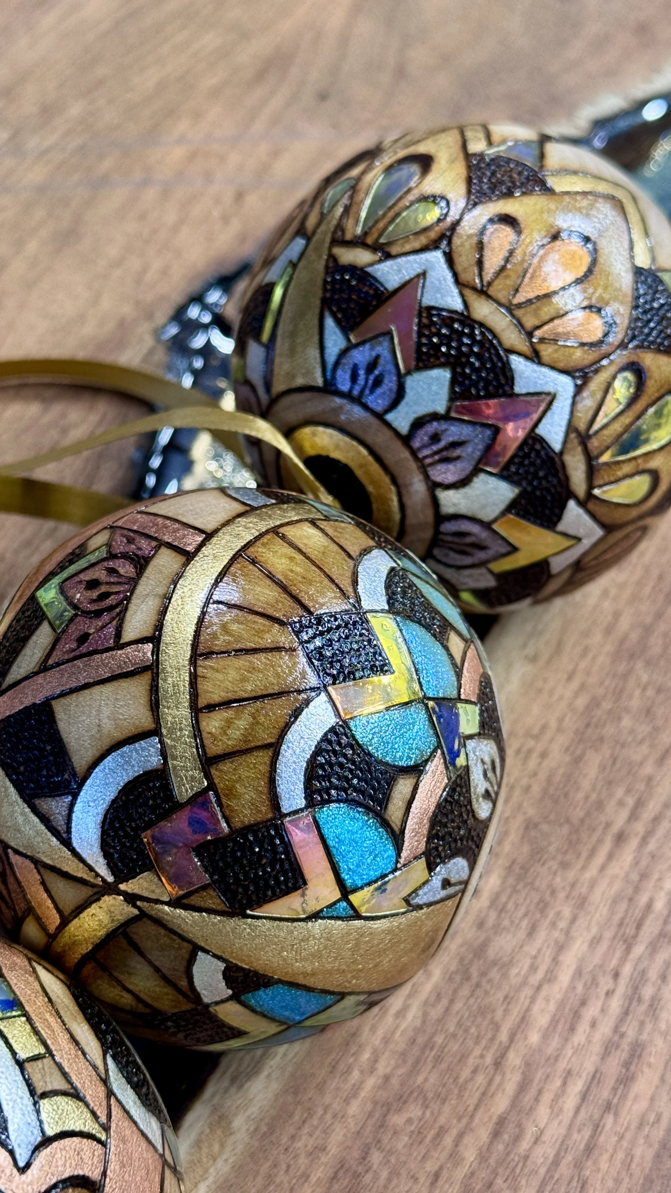 Firelight Orb by Austin artist Anne Shackelford, radiant wood art with gilding, pigment, and shimmer light.