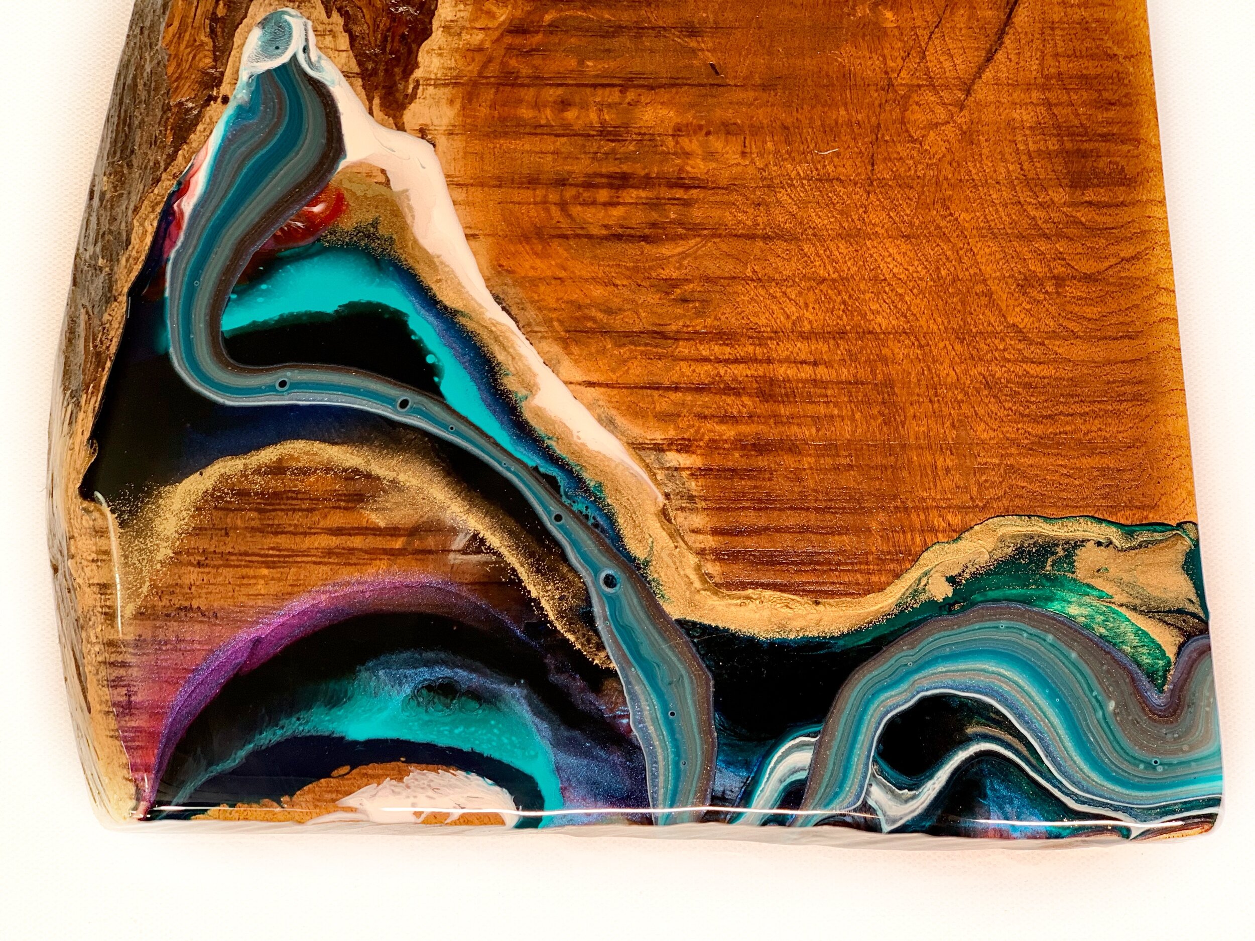 Table art with pyrography, gold leaf and resin glass on Texas mesquite.
