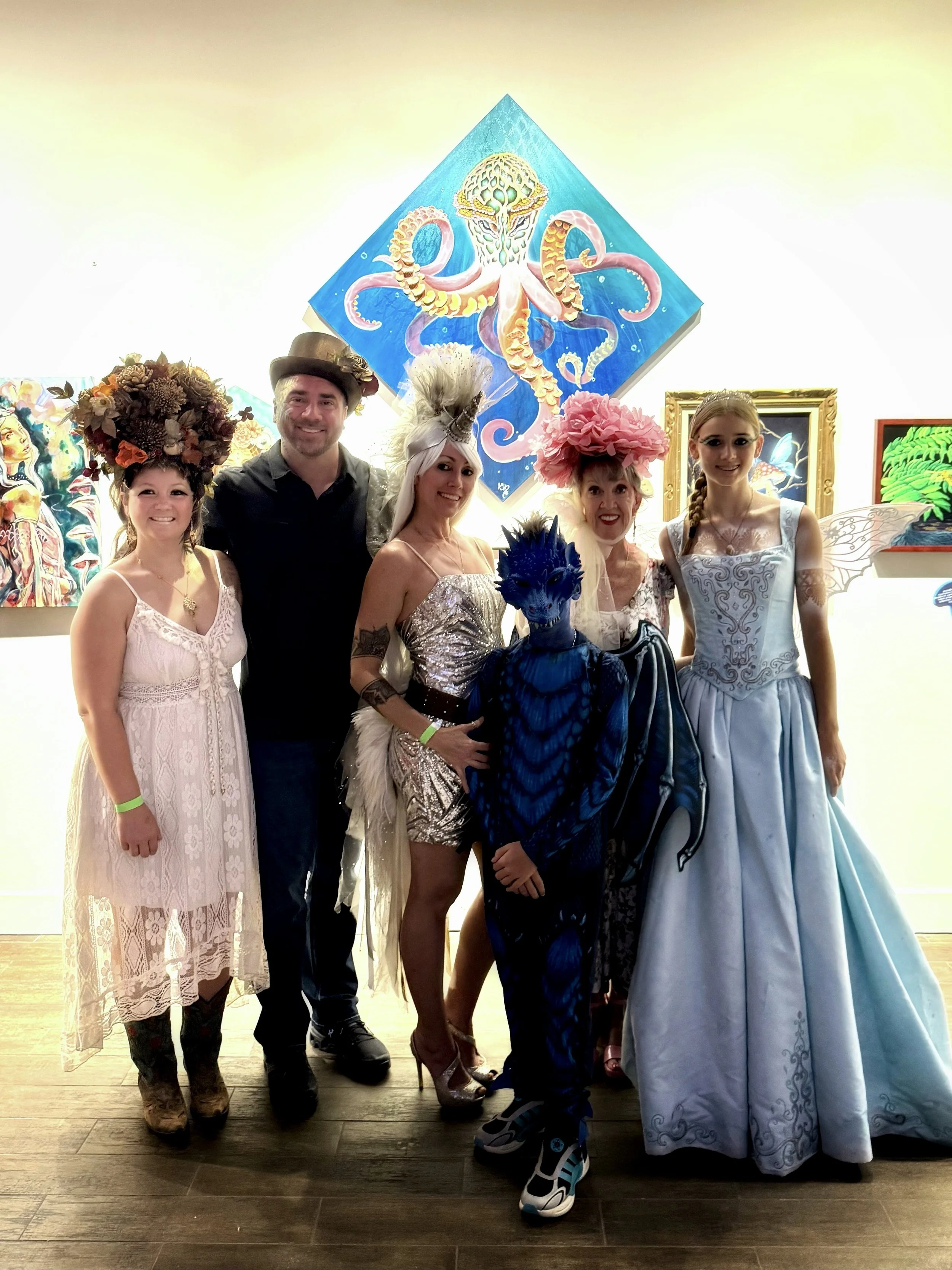  Anne Shackelford with her family at ArtUs Co during the  Realms of Fungi opening . A joyful night of art, costumes, and creativity featuring body art, costumes, and a first-place dragon in the costume contest. 2025. 