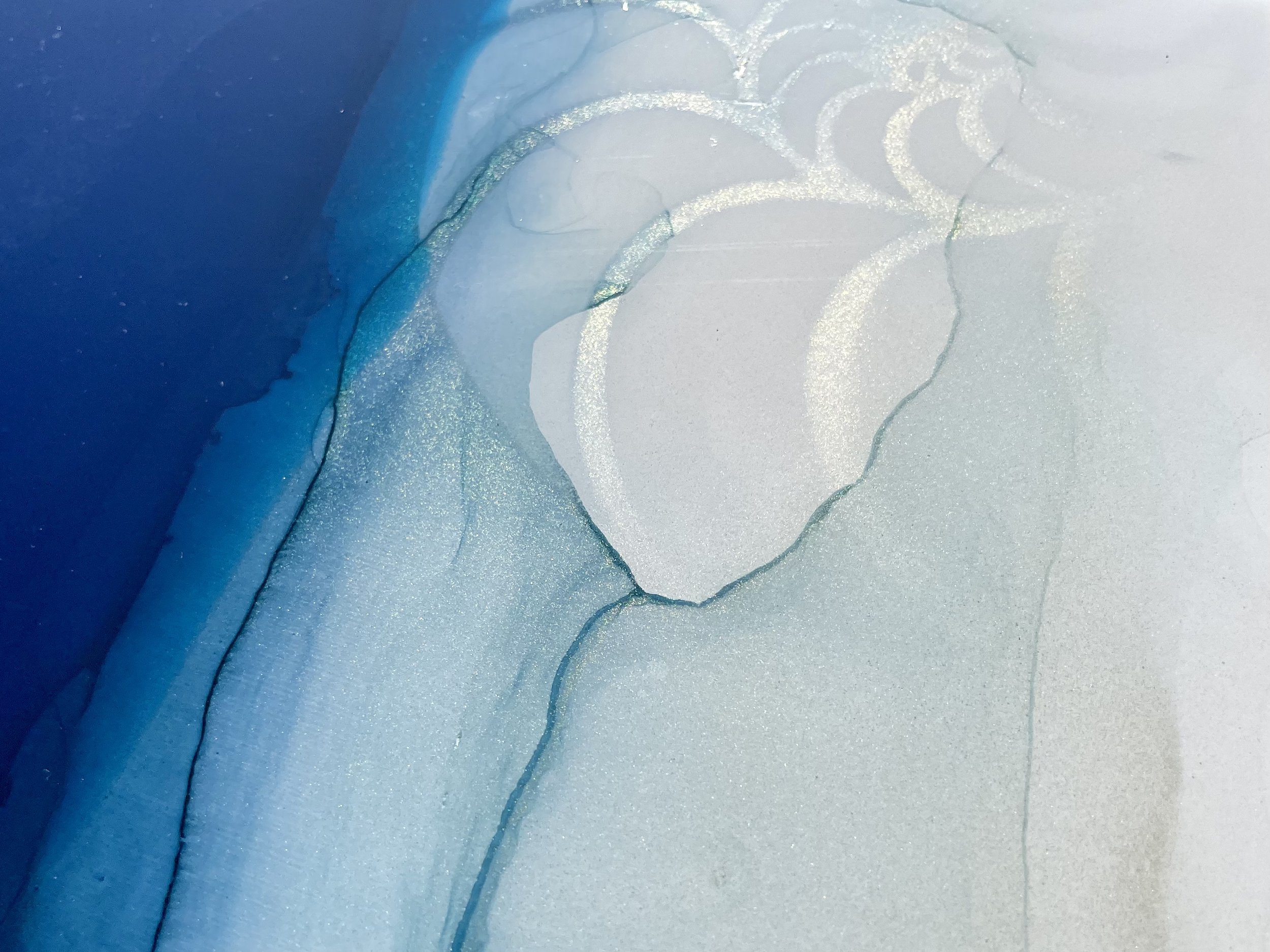 Functional art applied directly to a door using alcohol ink, resin, and paint