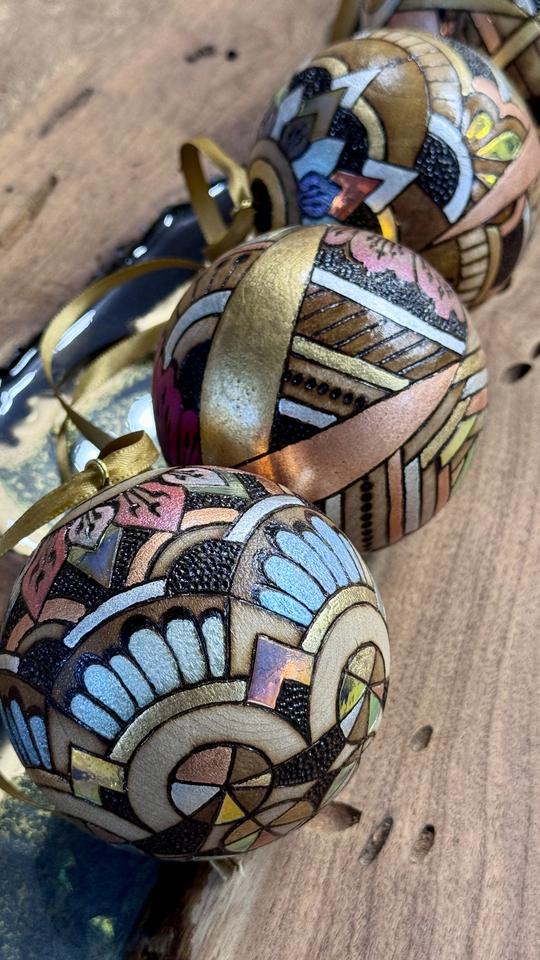 Firelight Orb by Austin artist Anne Shackelford, radiant wood art with gilding, pigment, and shimmer light.
