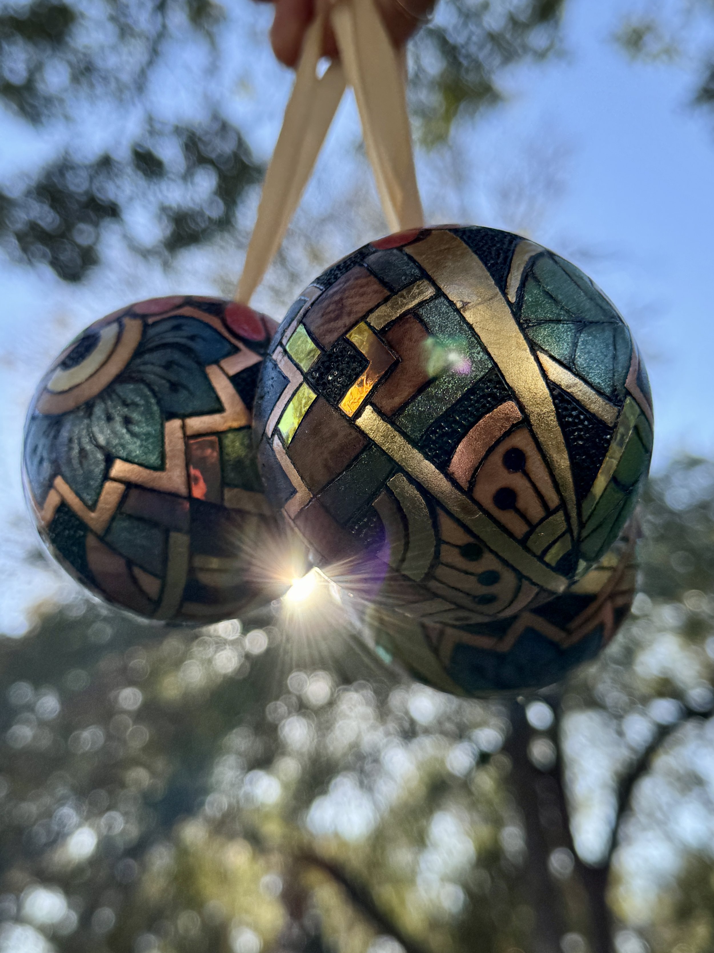 Firelight Orb by Austin artist Anne Shackelford, radiant wood art with gilding, pigment, and shimmer light.