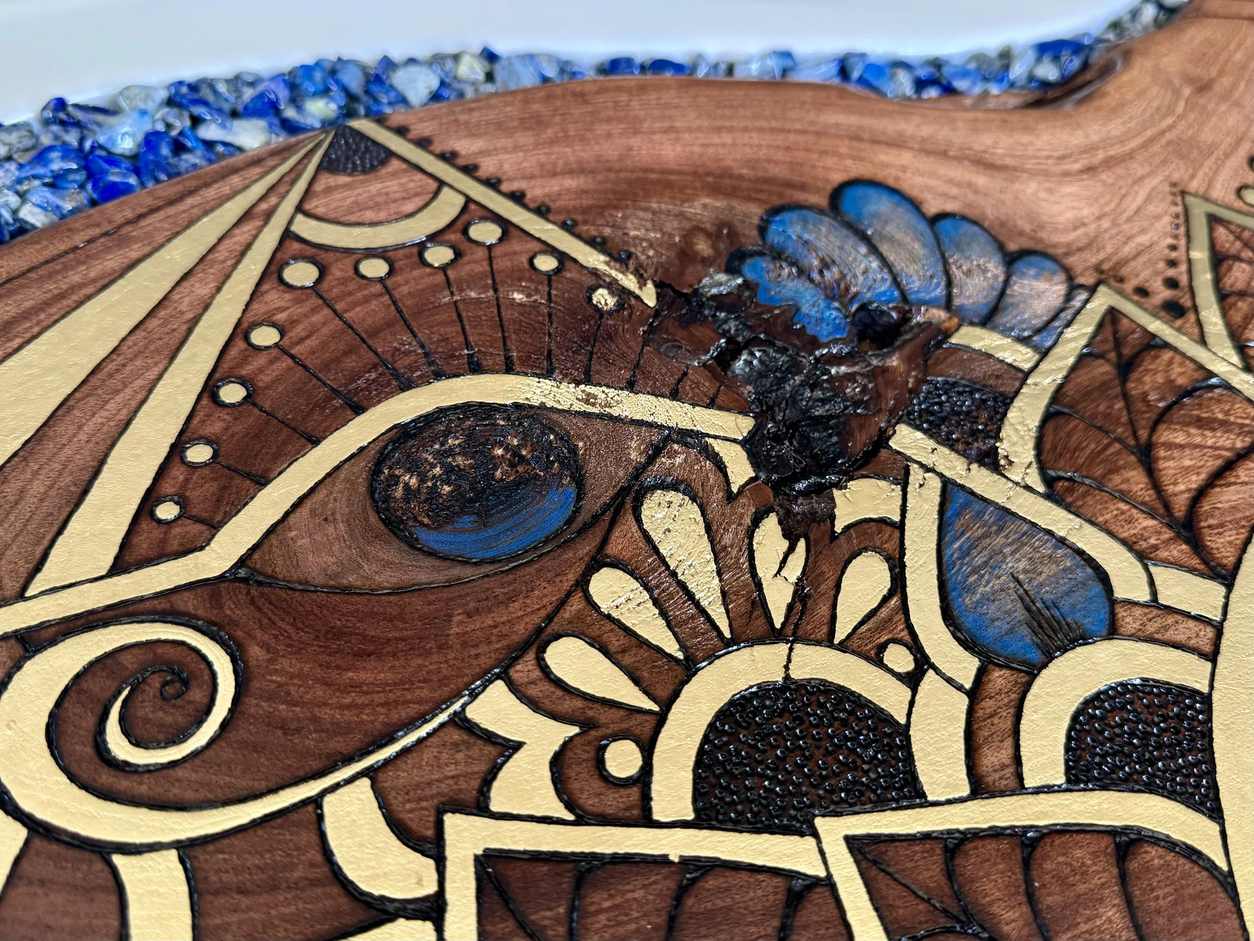 Handcrafted Saturn inspired wall art with scarab symbolism, pyrography on Texas mesquite and gold leaf