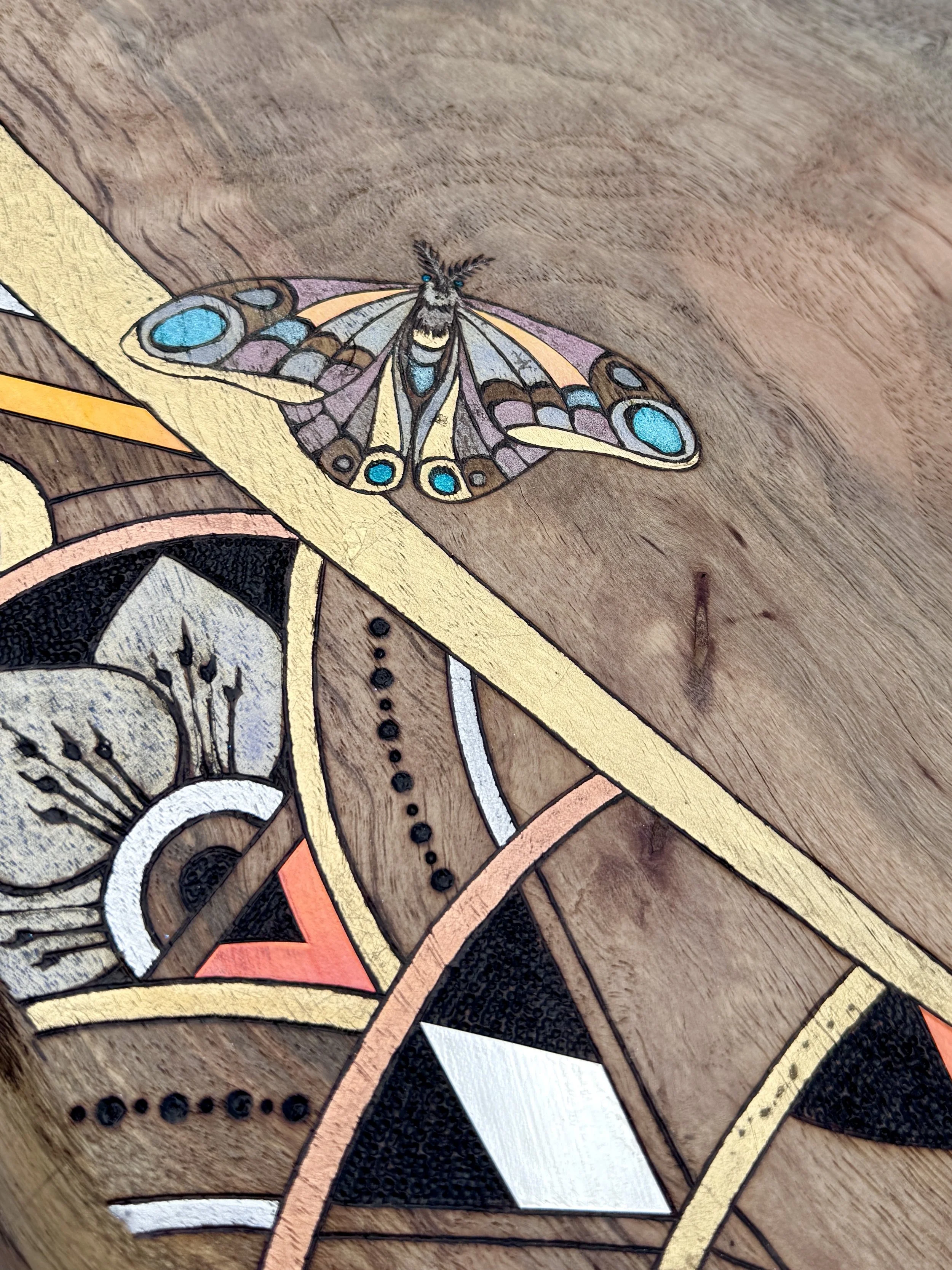 Butterfly detail within Alchemy of Becoming by Anne Shackelford, surrounded by layered geometric elements.