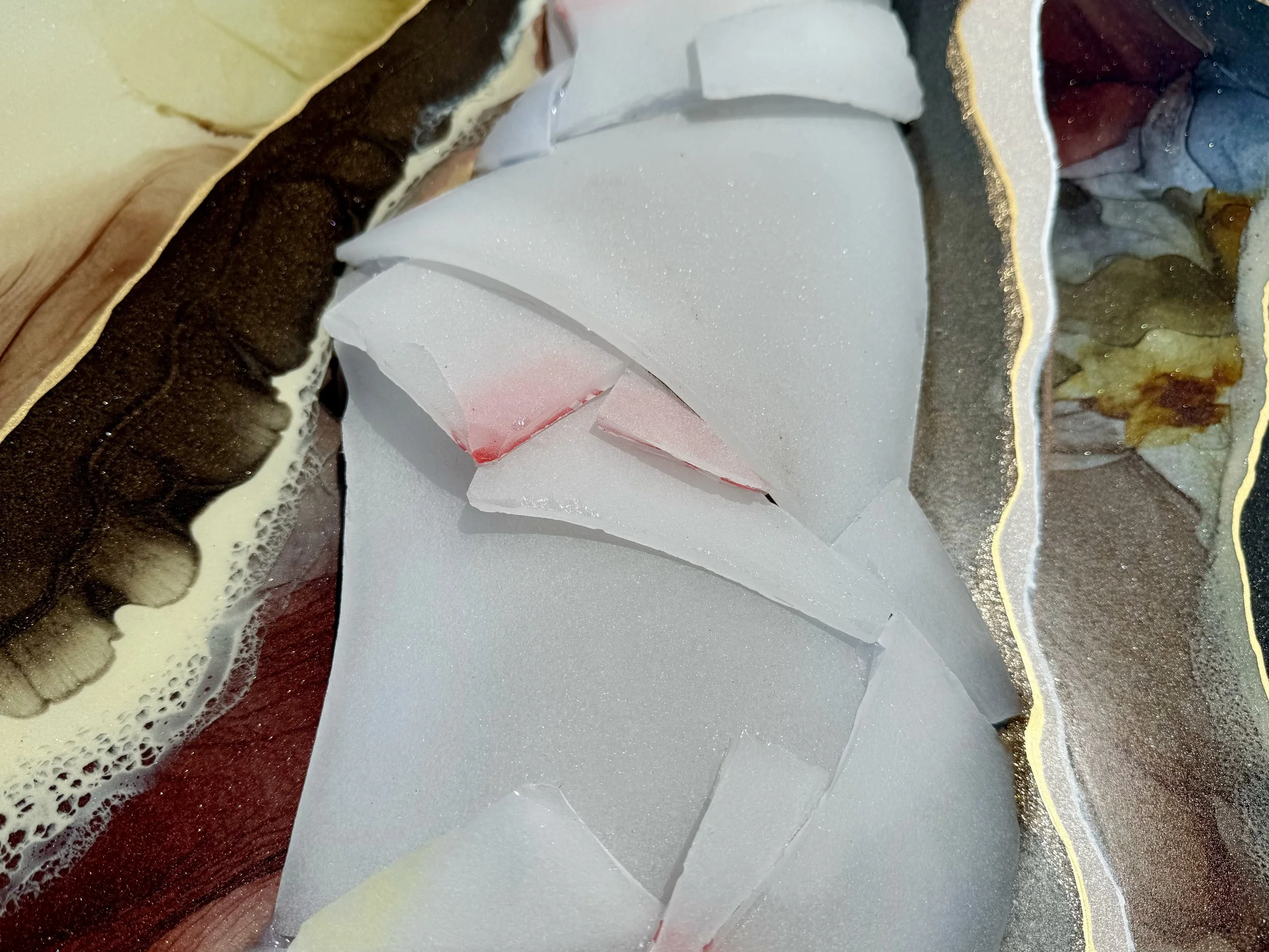 Detail view of reconstructed wall art with reflective materials