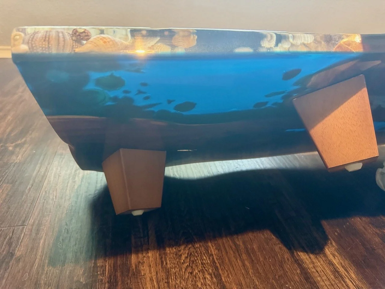 Resin surface illuminated by studio lighting, emphasizing clarity and depth.