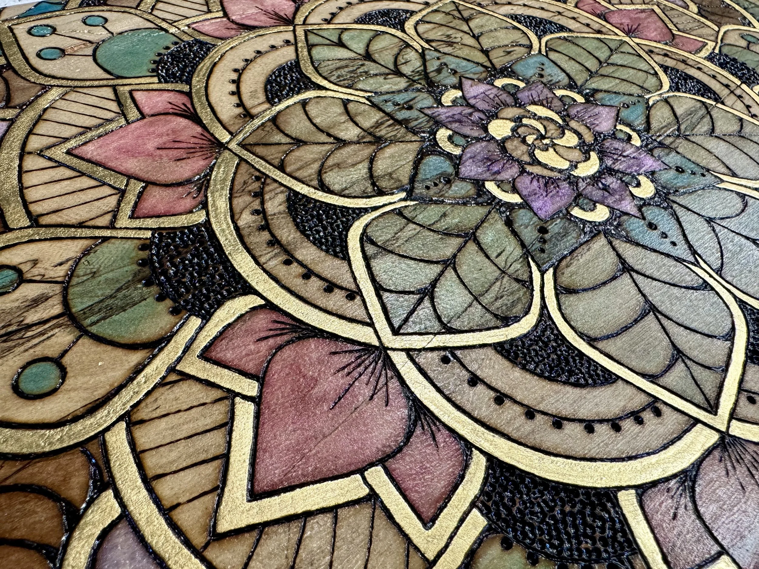 Living geometry wall art with pyrography, alcohol ink, and gold leaf