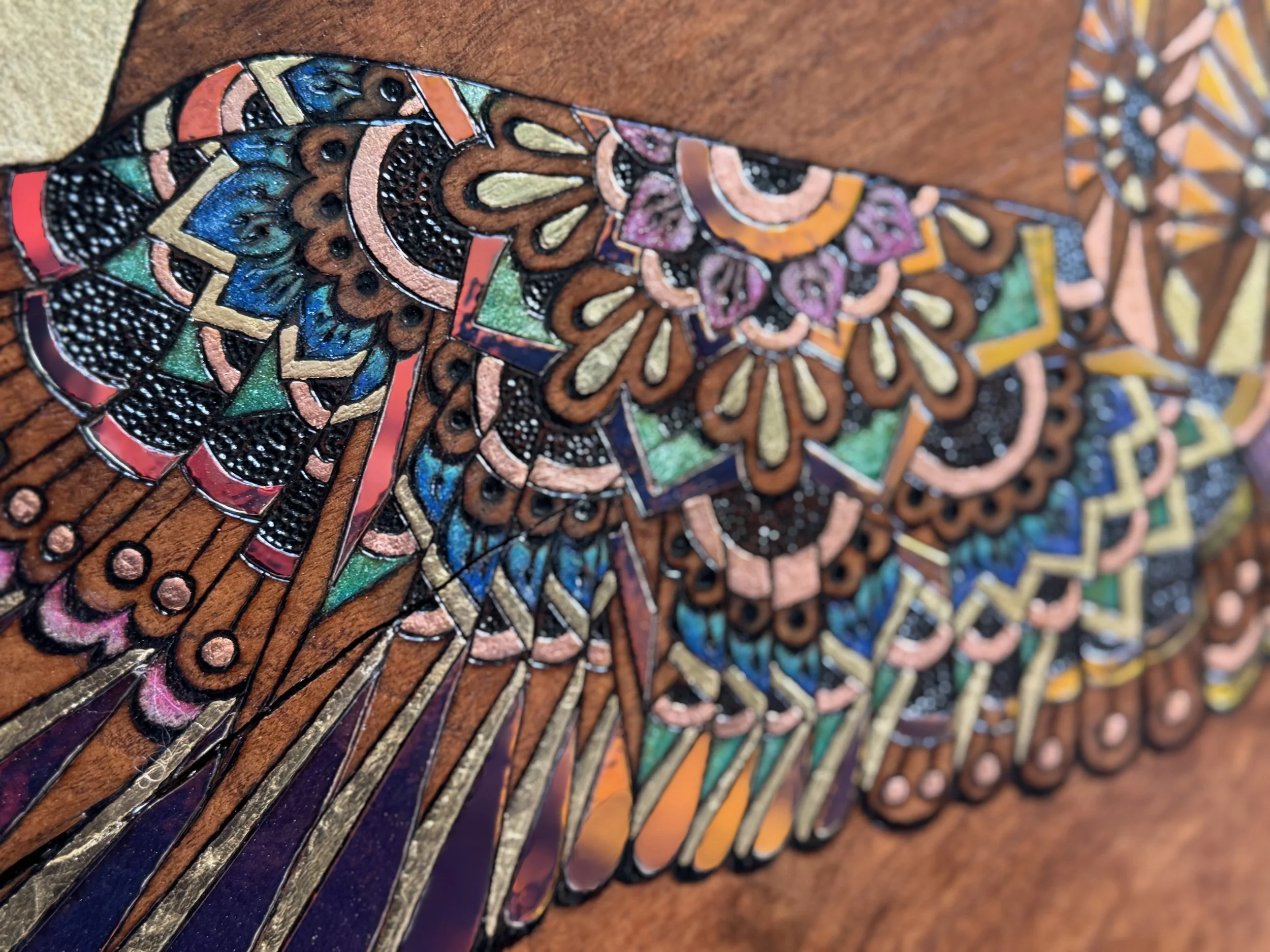 Handcrafted luminous wall art Emberwing by Austin artist Anne Shackelford, resin and pigment on mesquite.