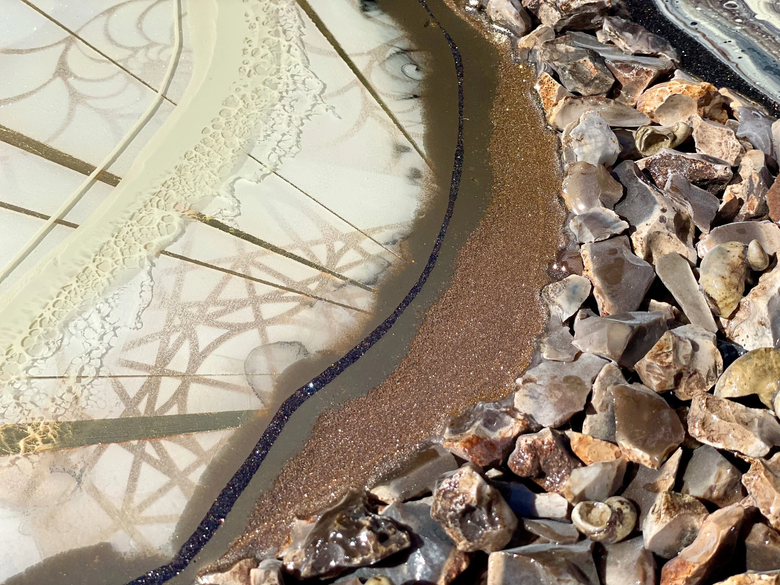 Handcrafted wall art by Anne Shackelford featuring fossilized shell, stone, and resin layers.