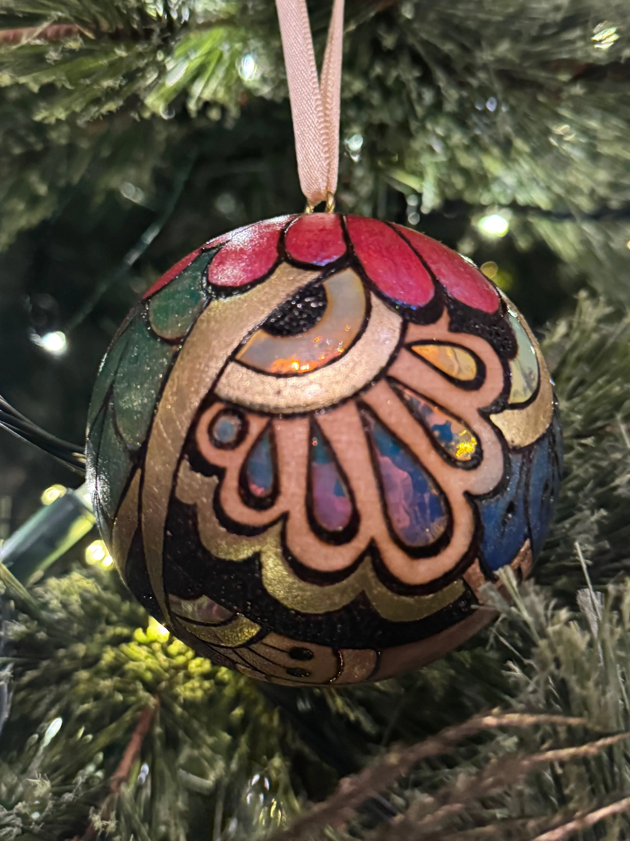 Holiday Firelight ornament by Austin artist, capturing warmth and radiance through layered materials.