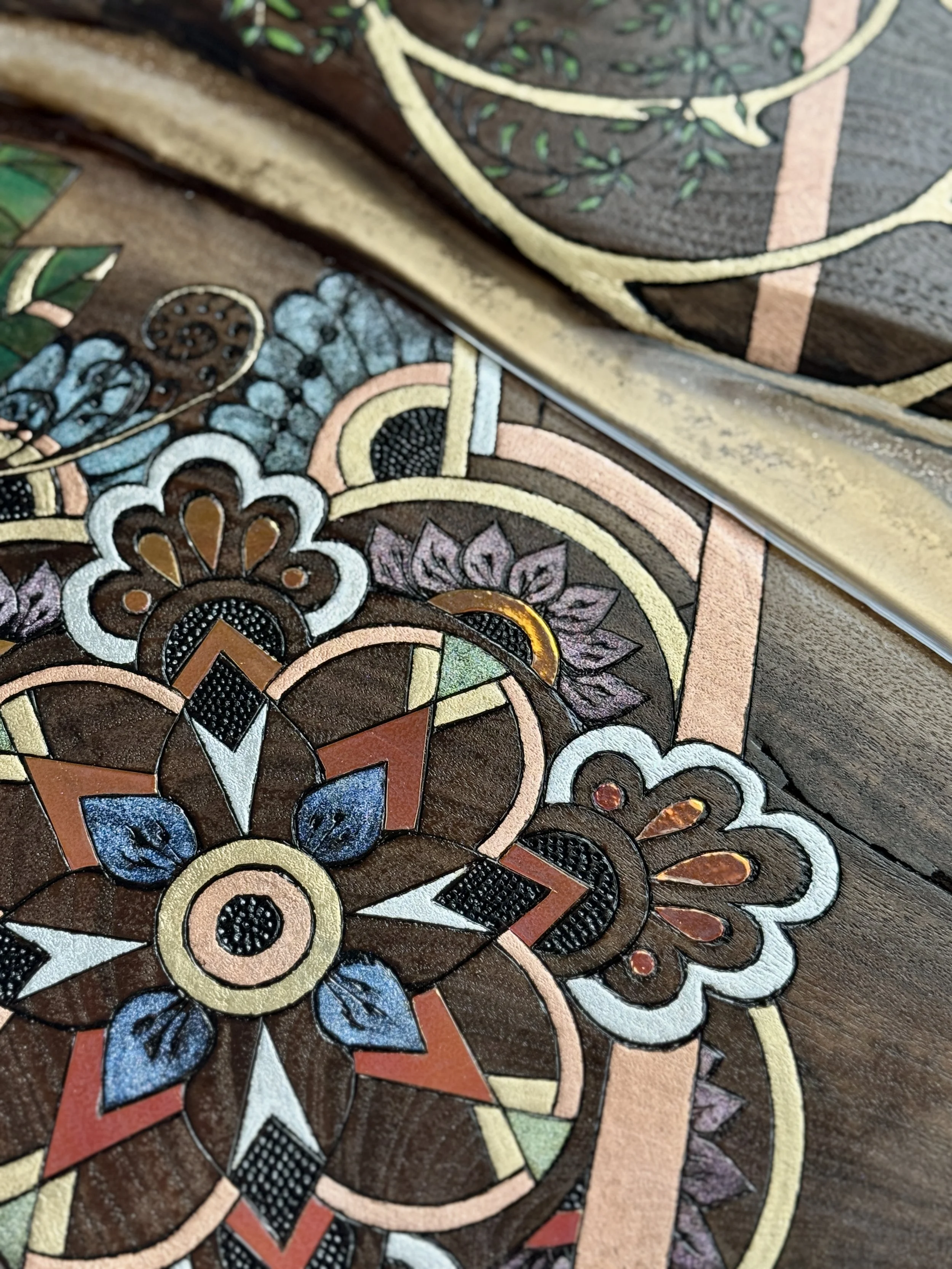 Artisan crafted wood wall decor with metal leaf and resin accents