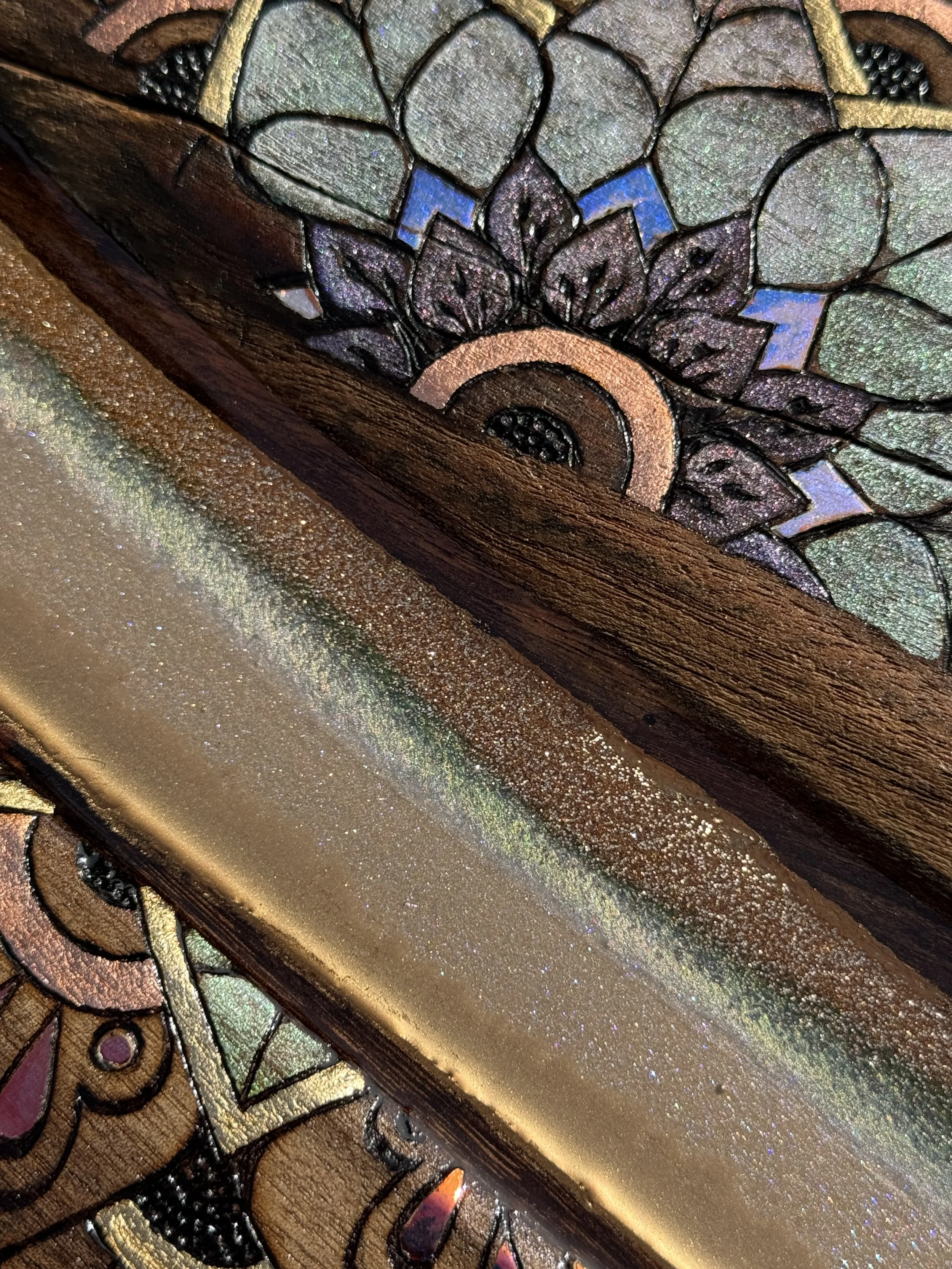 Resin artwork with holographic film creating opal and stained glass light effects