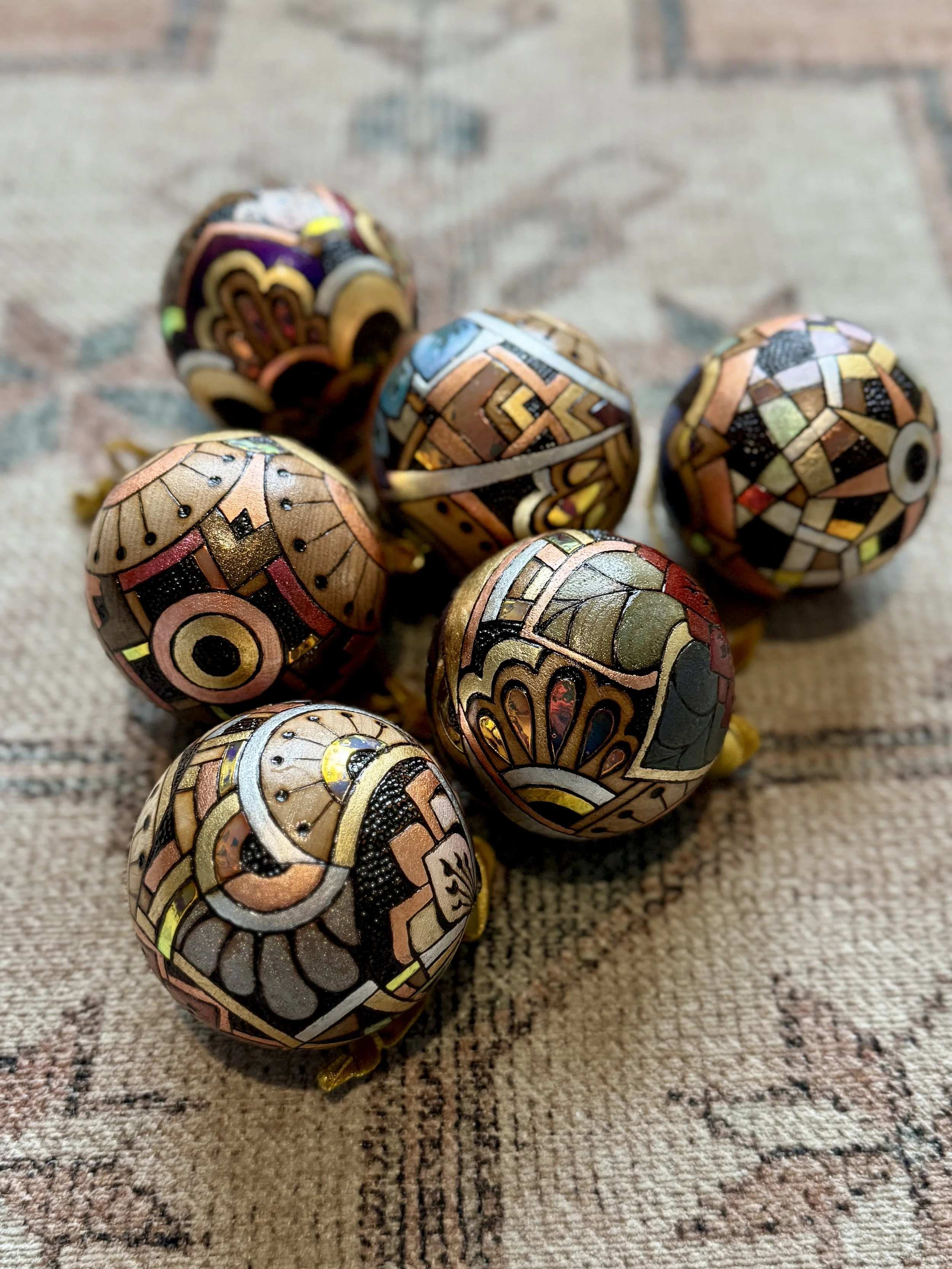 Firelight Orb luminous wood ornament featuring shimmer, metal leaf, and reflected light by Austin based artist Anne Shackelford