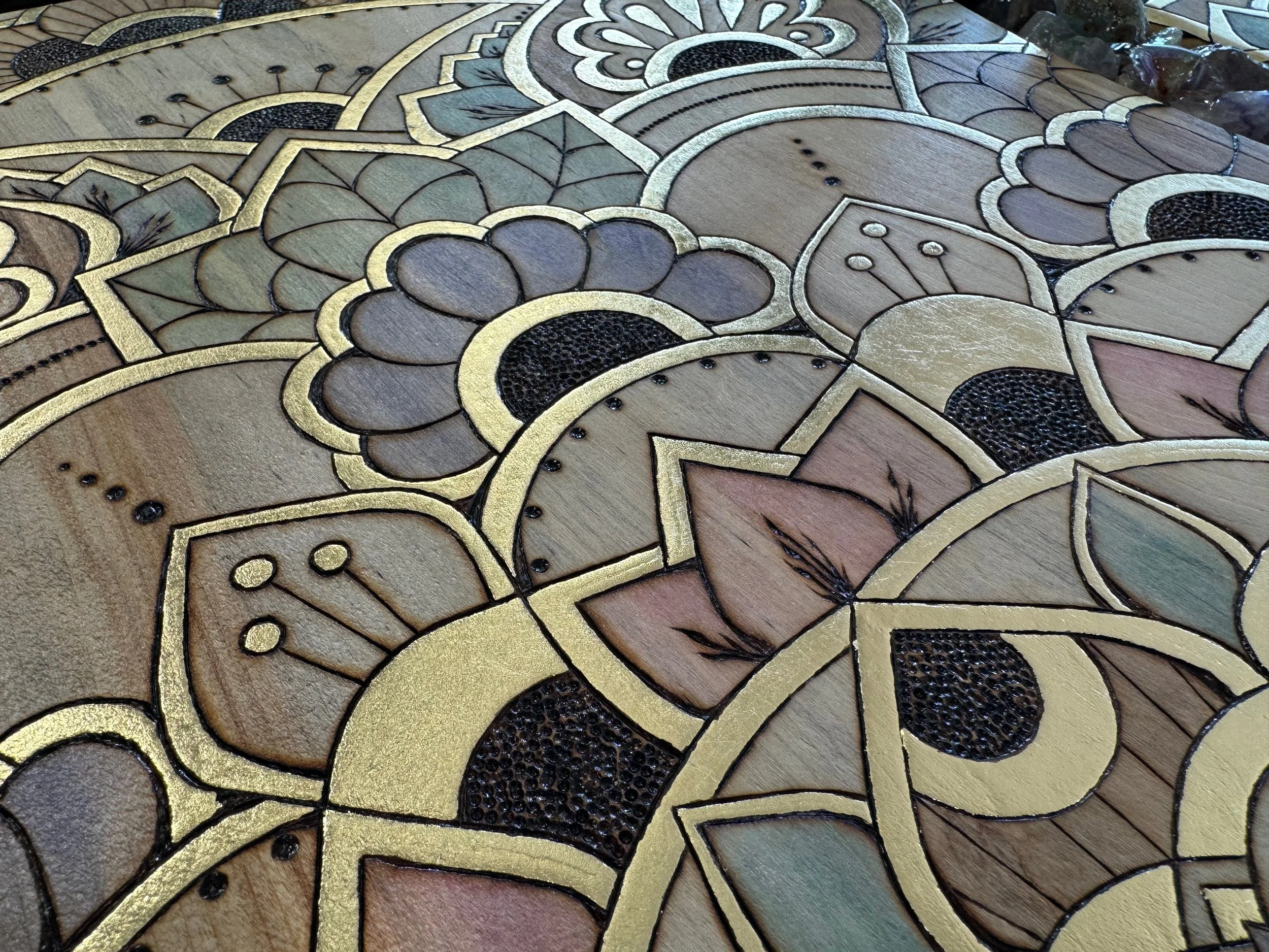 Pyrography and alcohol ink on aspen panel, Parivrtta by Austin artist Anne Shackelford.