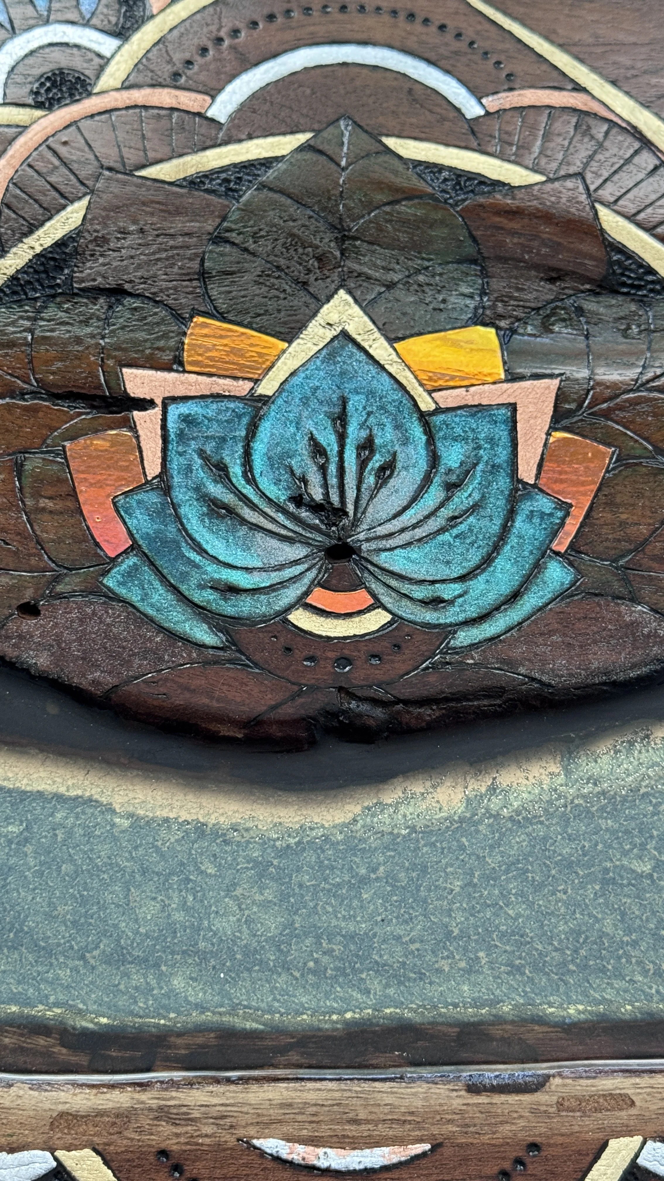 Close-up of pyrography and resin on Texas mesquite wood
