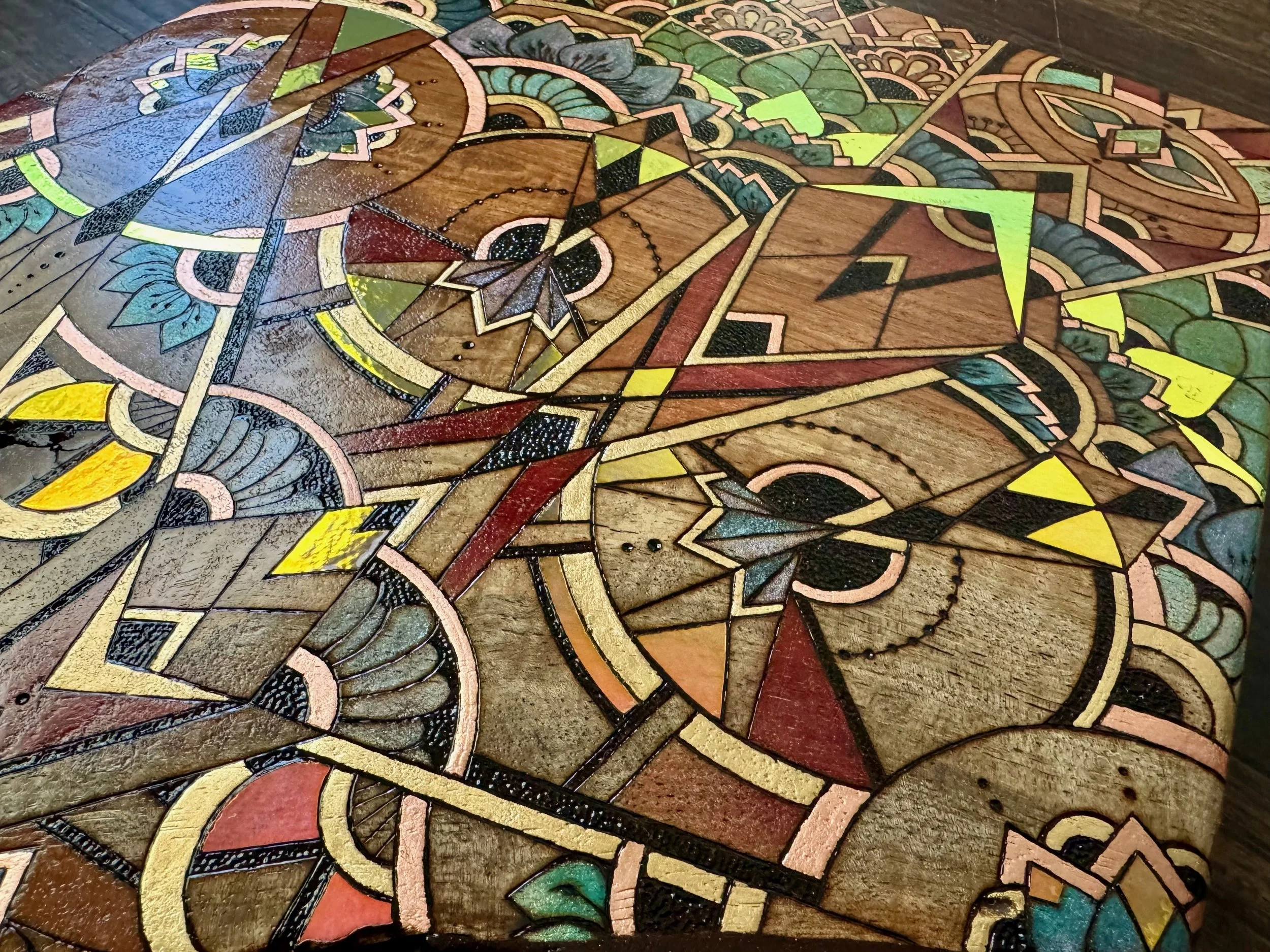 Floral mandala detail with colored pencil and pyrography, sacred geometry wall art by Austin artist.
