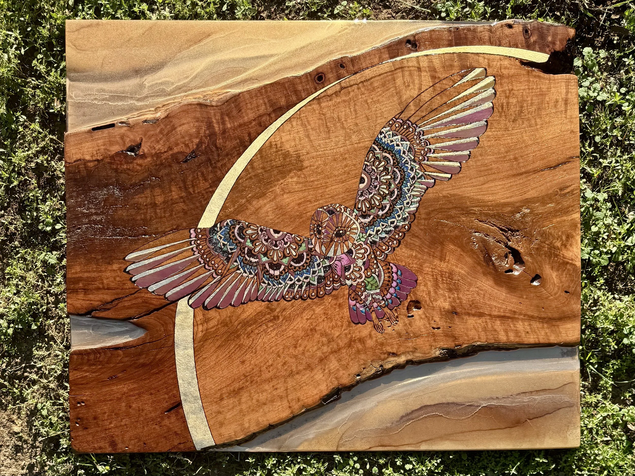 Austin artist Anne Shackelford with Emberwing wall art, luminous mixed media on mesquite.
