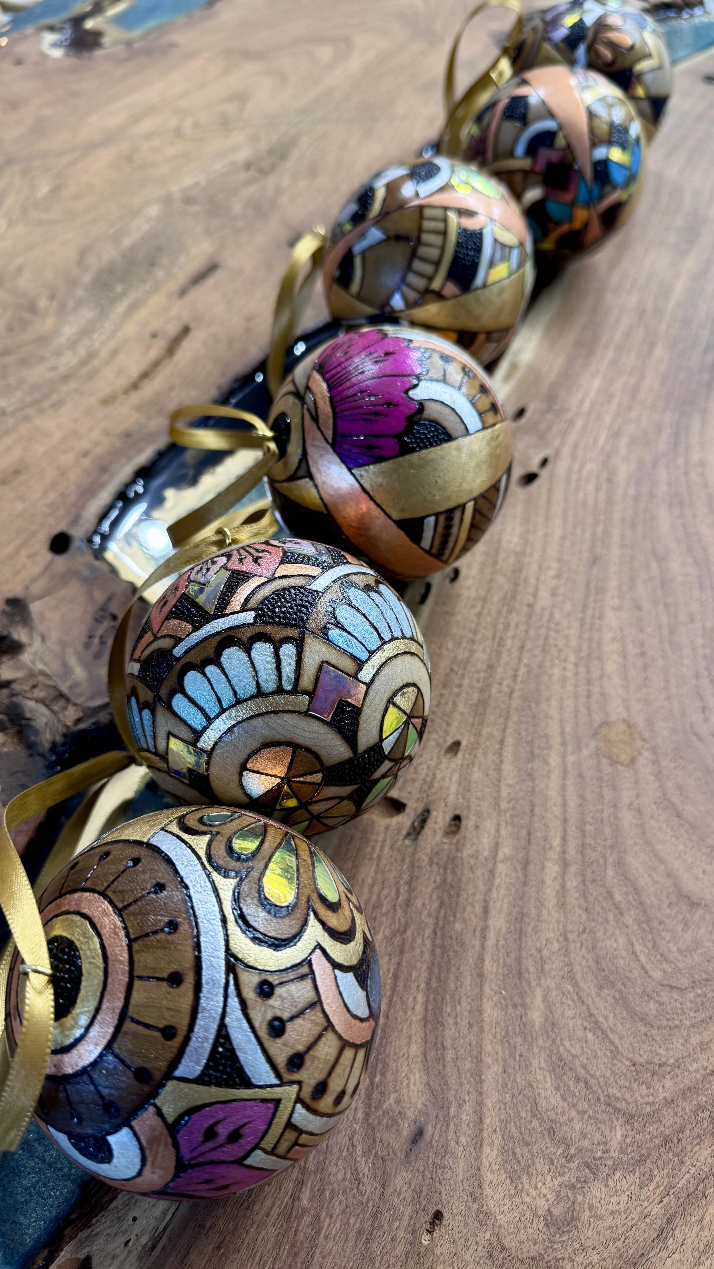 Firelight Orb by Austin artist Anne Shackelford, radiant wood art with gilding, pigment, and shimmer light.