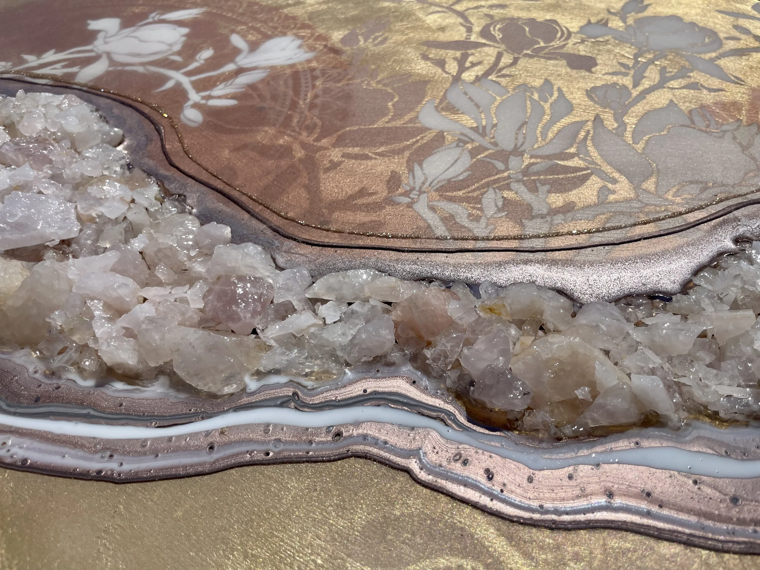 Symbolic wall art with rose quartz and reflective materials