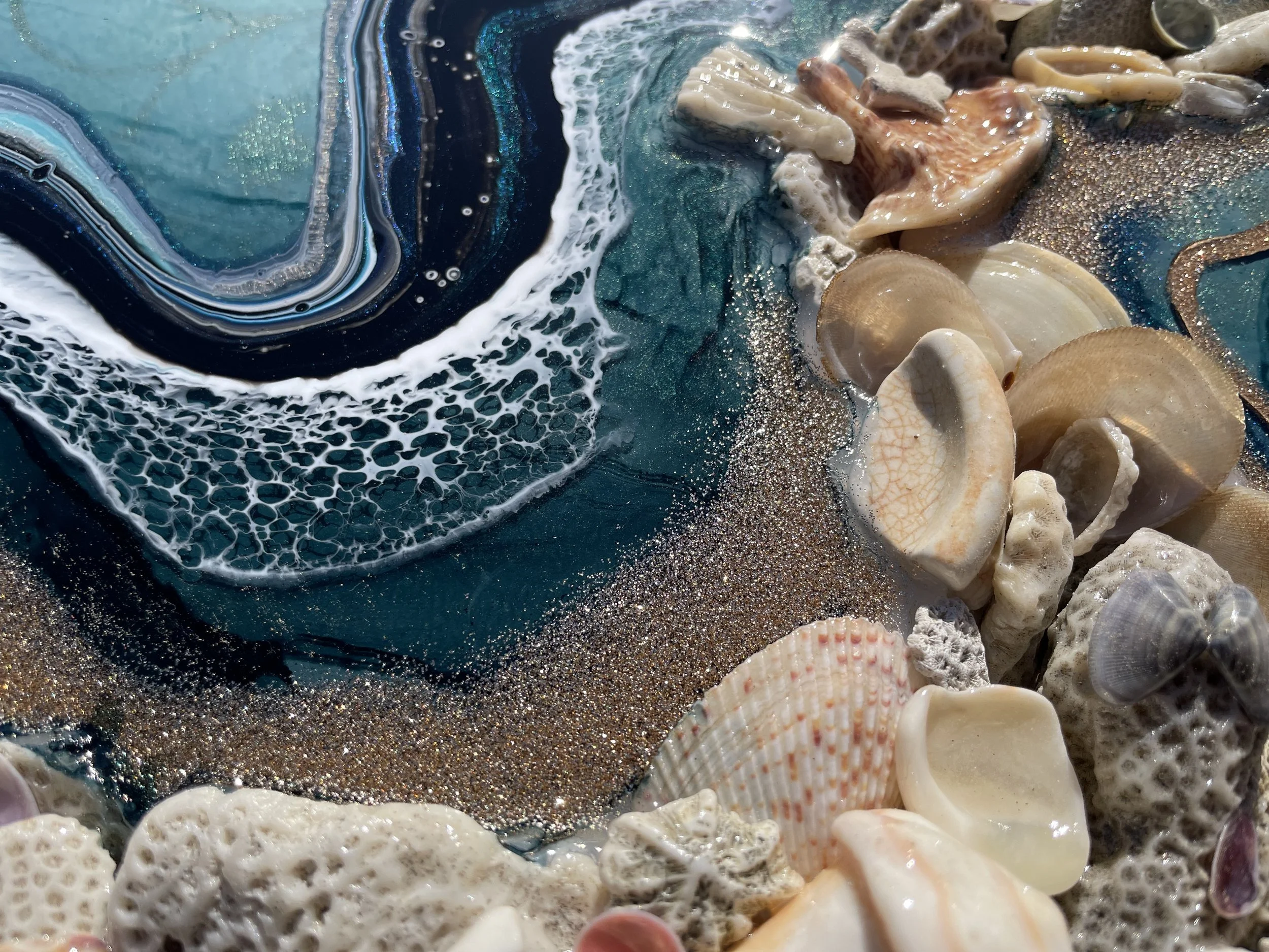 Handcrafted wall art featuring collected materials and layered surface