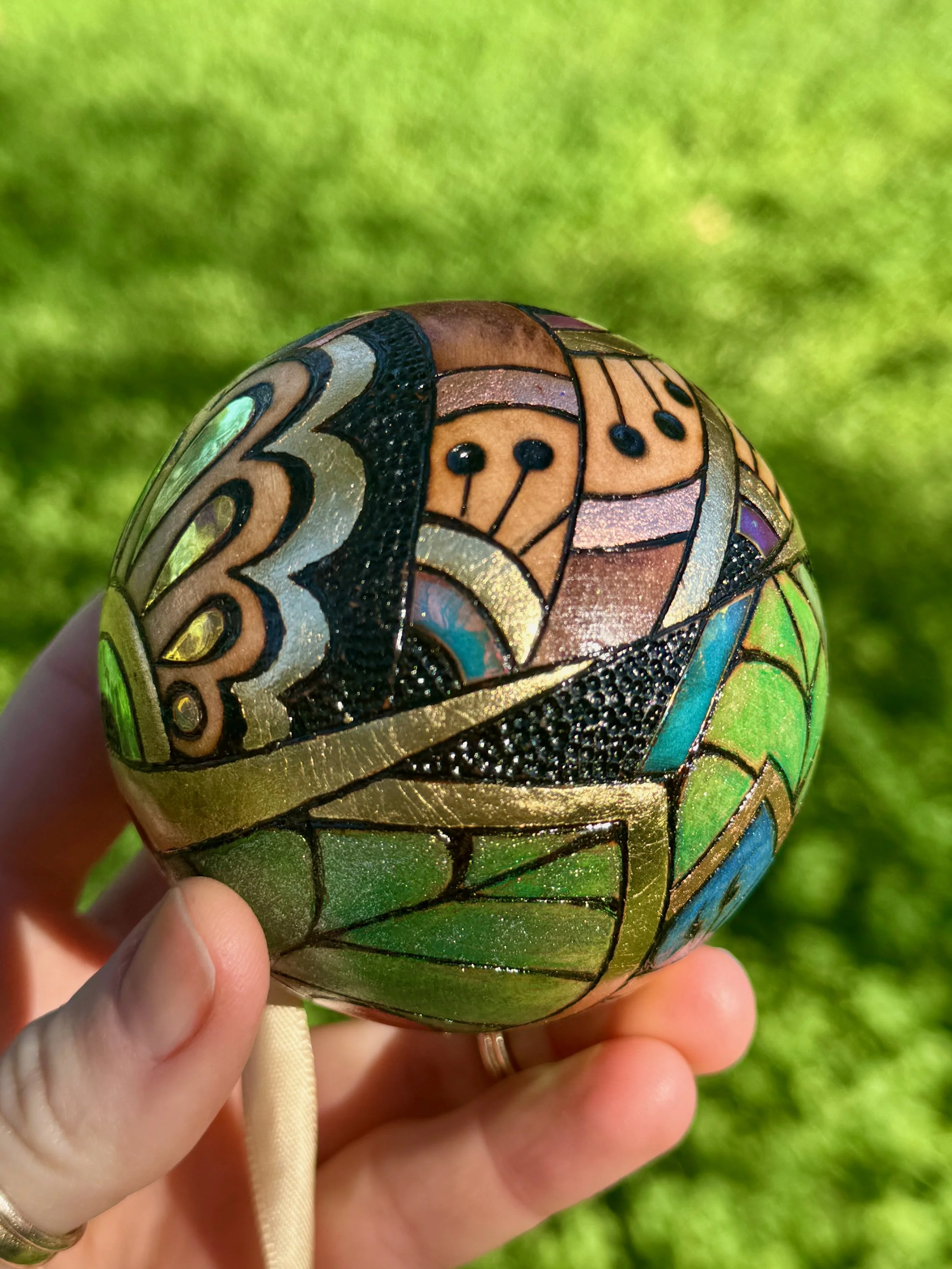 Firelight Orb wood art by Texas artist Anne Shackelford, gilded, shimmery, and richly textured.