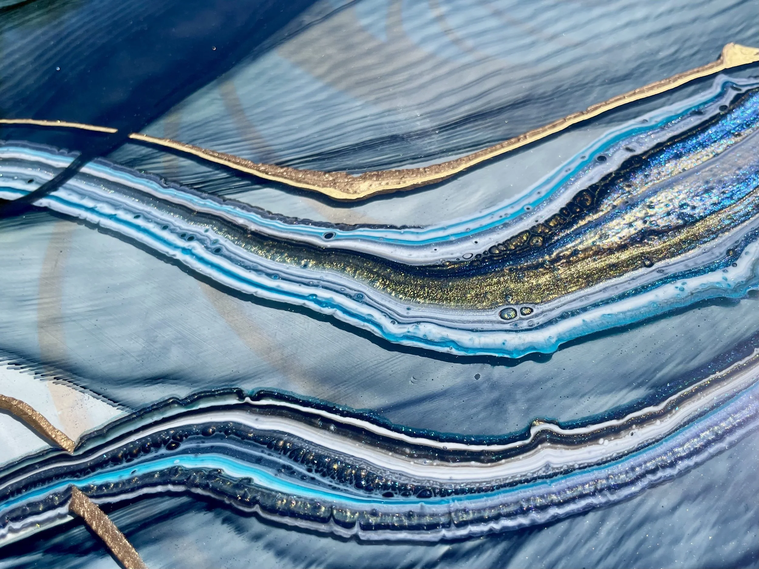 Symbolic wall art with flowing form and concealed geometry