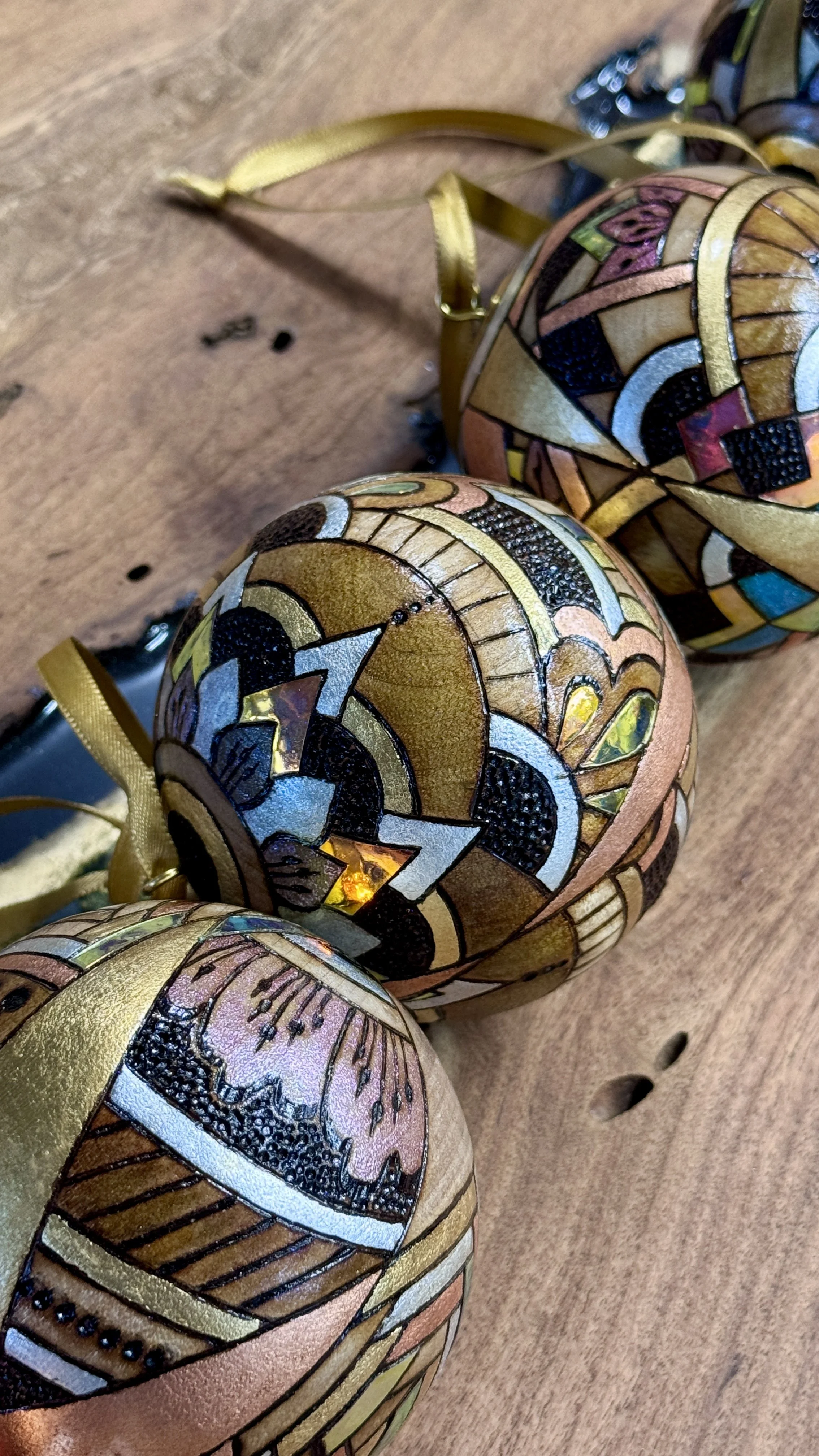 Firelight Orb by Austin artist Anne Shackelford, radiant wood art with gilding, pigment, and shimmer light.