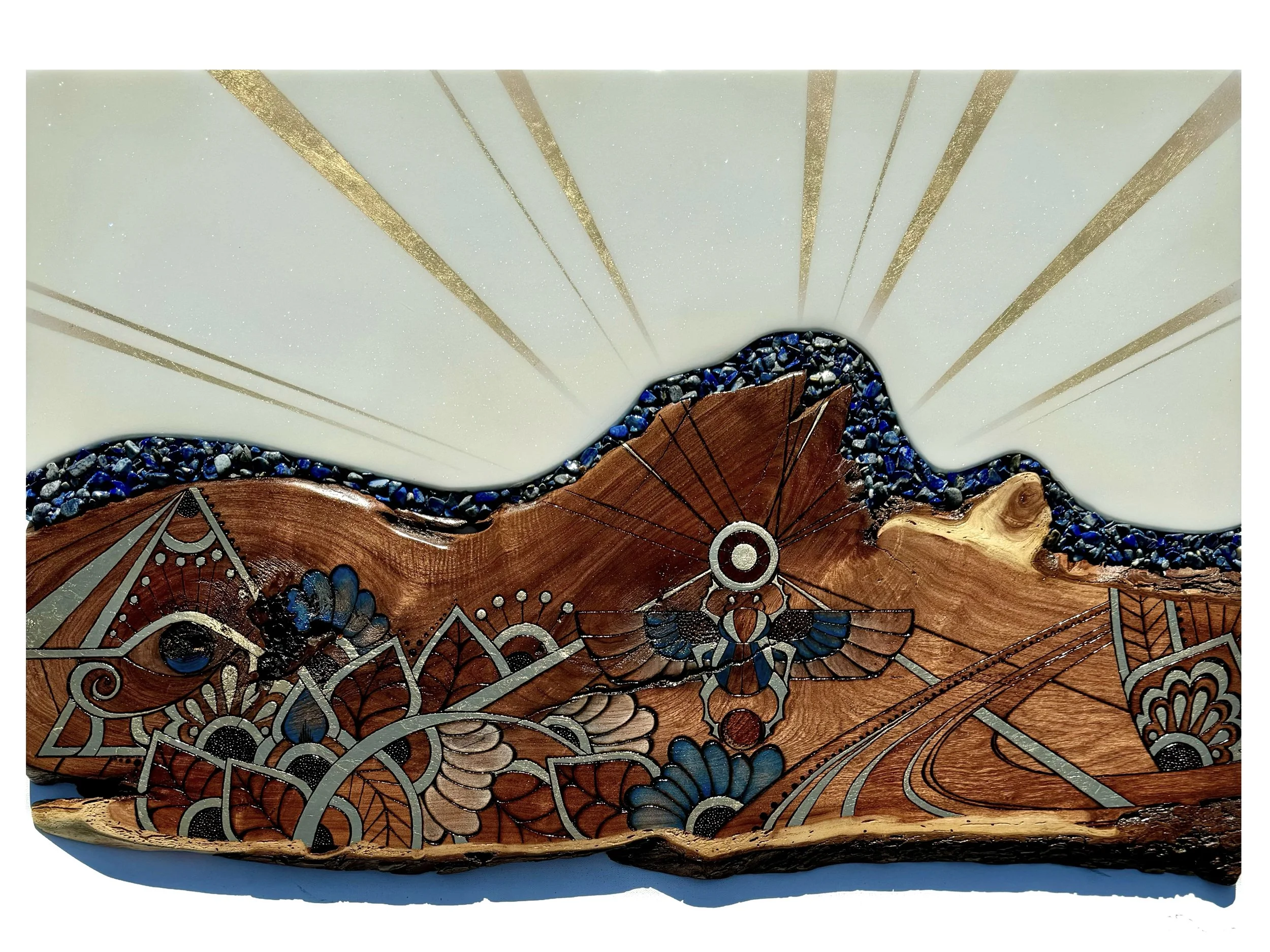 Wall art on Texas mesquite with pyrography, colored pencils, gold leaf, resin and lapis lazuli.