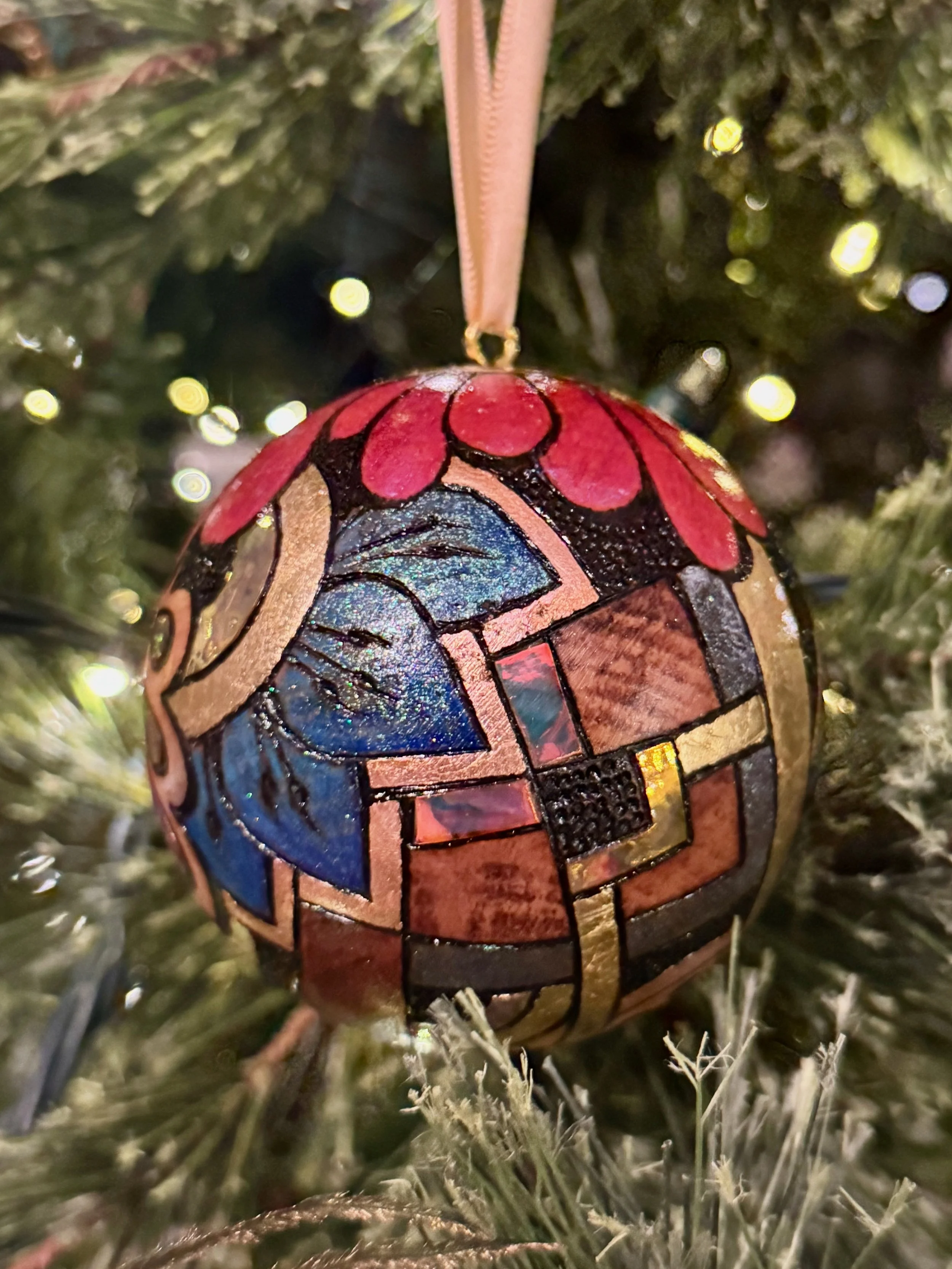 Firelight Orb from Chrysalis Austin, glowing wood art infused with gilding, color, and light.