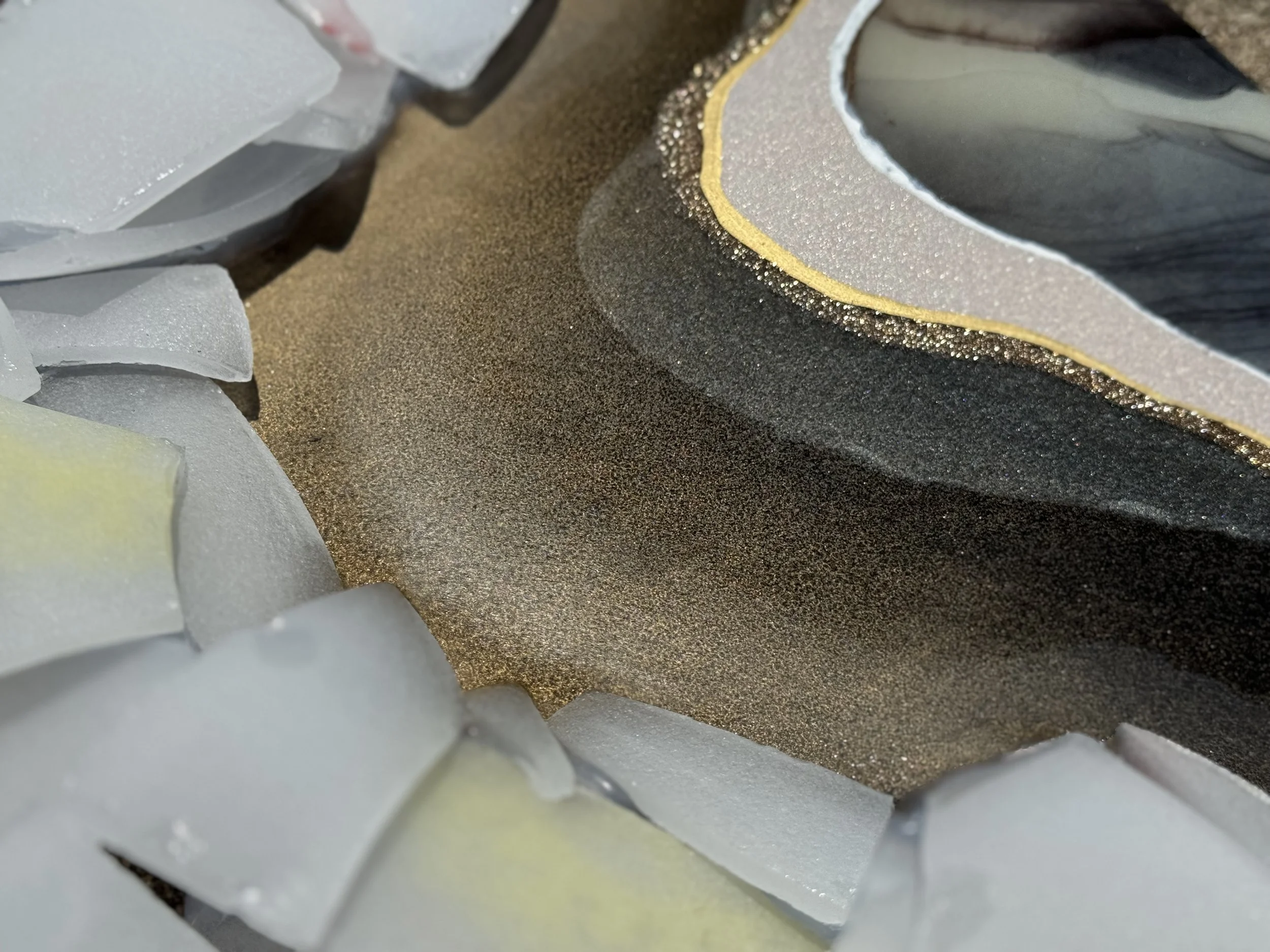 Wall art created with glass from broken crystal singing bowls