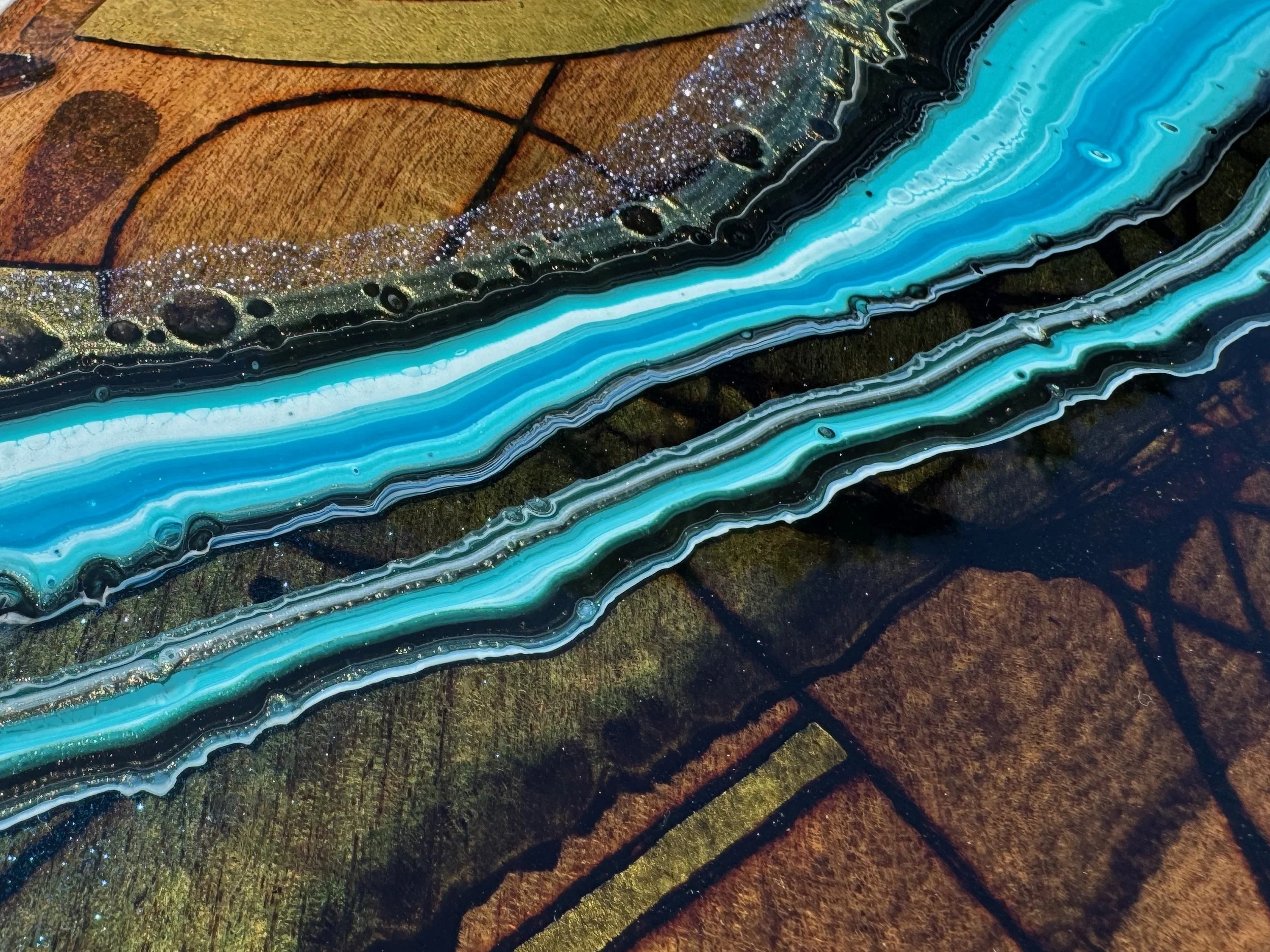 Handcrafted charcuterie board Replenish by Anne Shackelford, pyrography and resin artwork.