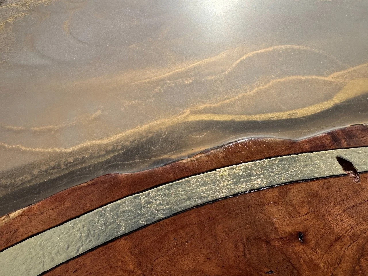 Hand-crafted wall art by Anne Shackelford featuring pyrography patterns and luminous gold pigment within resin layers.