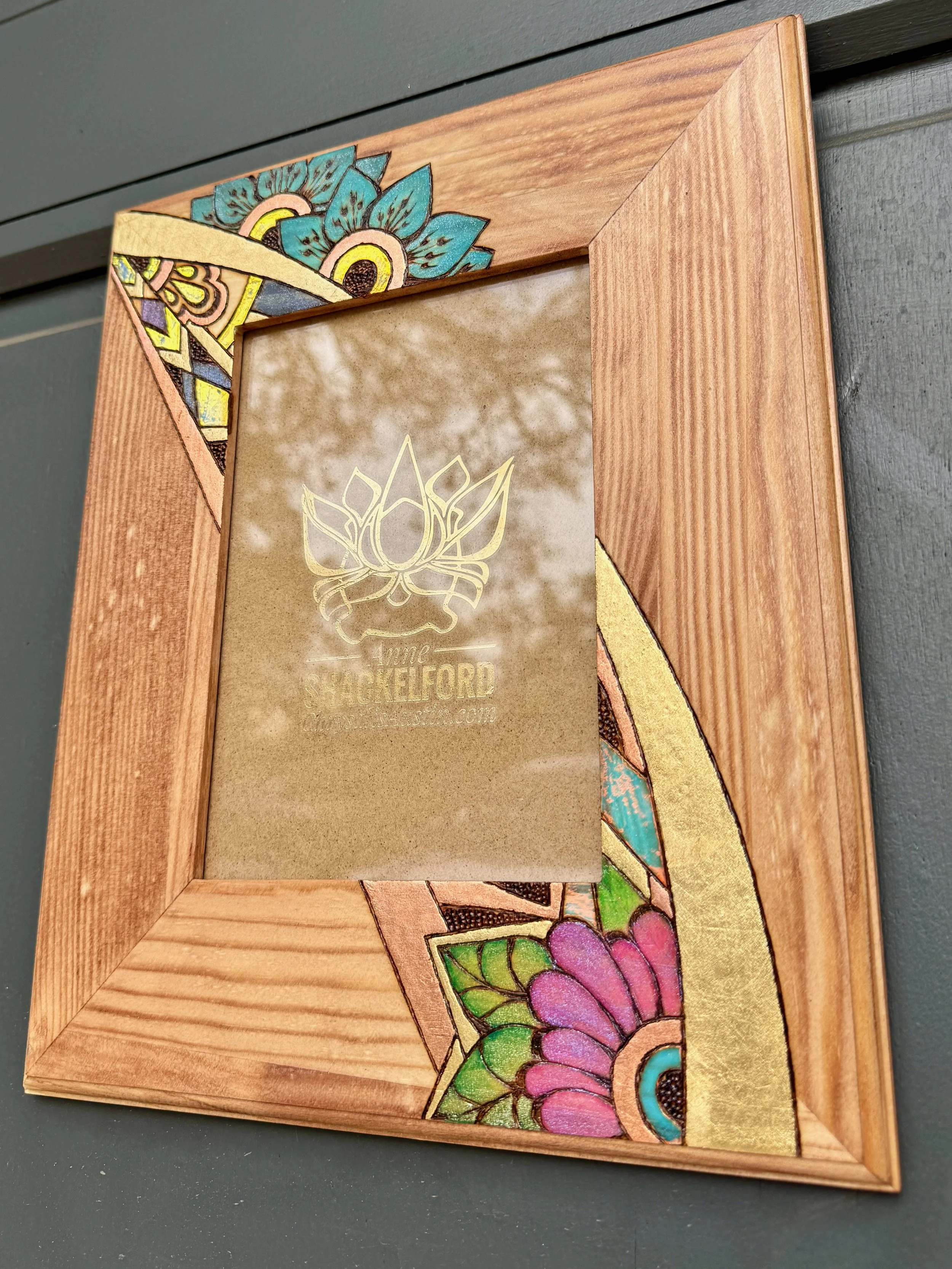 One-of-a-kind Firelight Frame by Anne Shackelford, wood burned functional art.