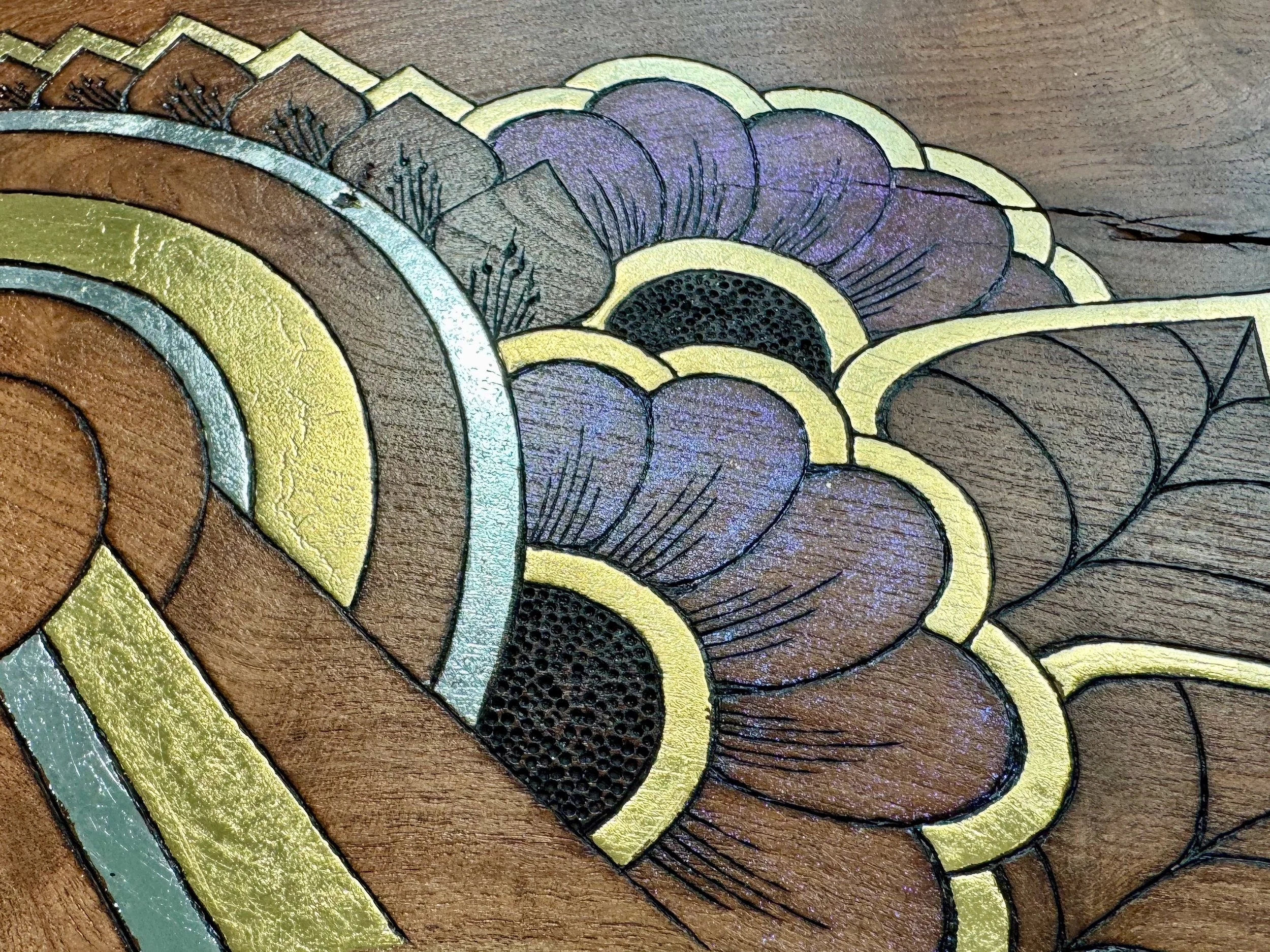 Pyrography and metal leaf wall art Metamorphosis by Austin artist Anne Shackelford.