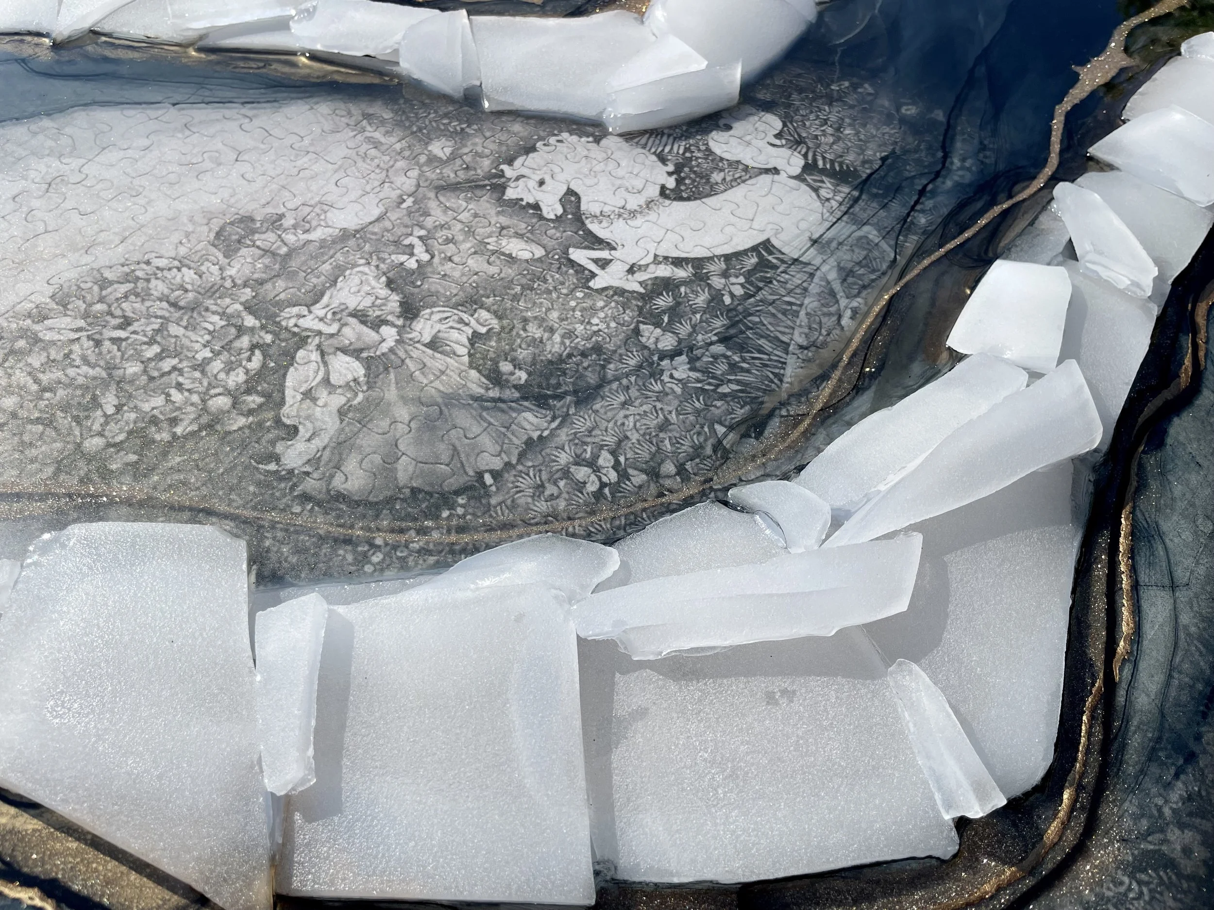 Wall art created with glass from broken crystal singing bowls