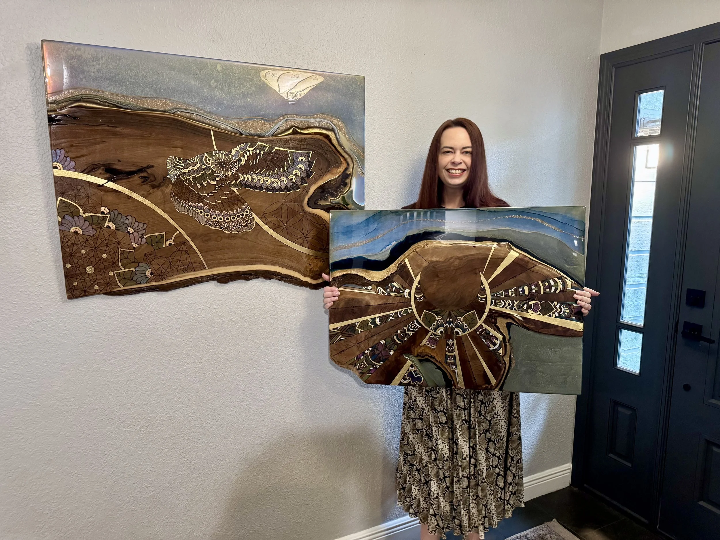 Patron holding the half moon wall art after purchase