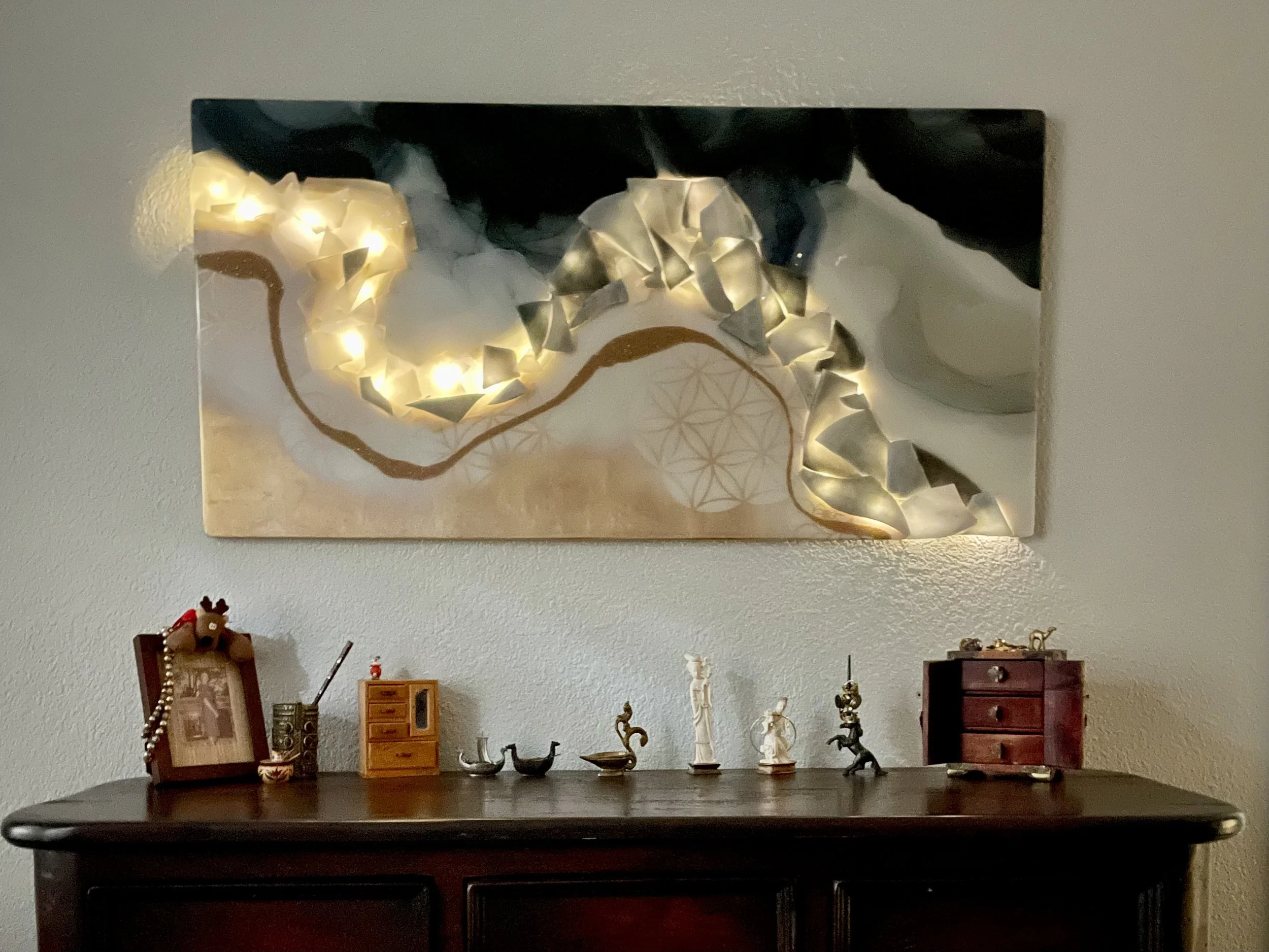 Anahata heart chakra wall art by Anne Shackelford displayed in a styled interior