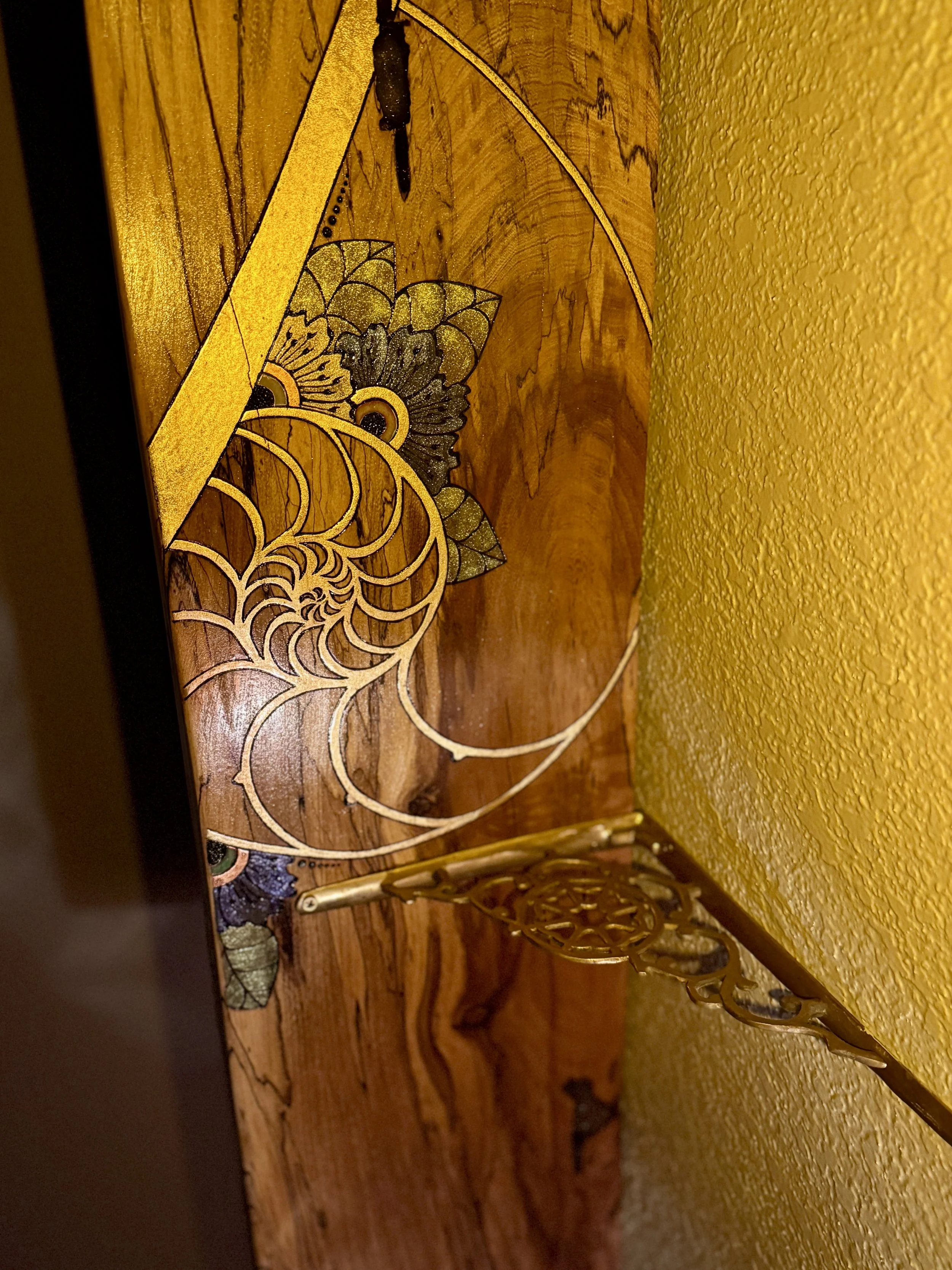 Storyteller by Anne Shackelford installed above a bed, showcasing a live-edge Texas pecan artwork designed to be both sculptural and functional.
