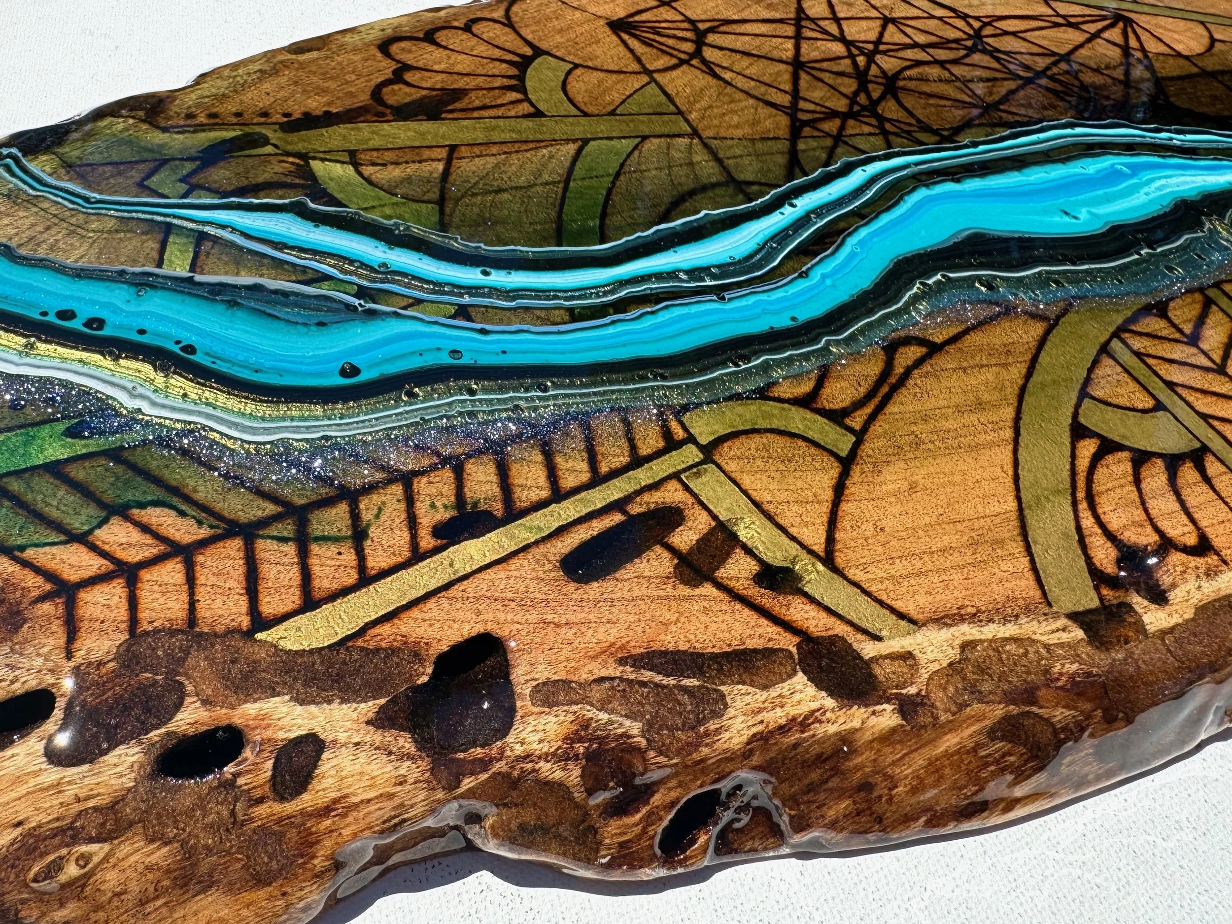 Functional home decor piece Replenish by Anne Shackelford, resin and pyrography on mesquite.