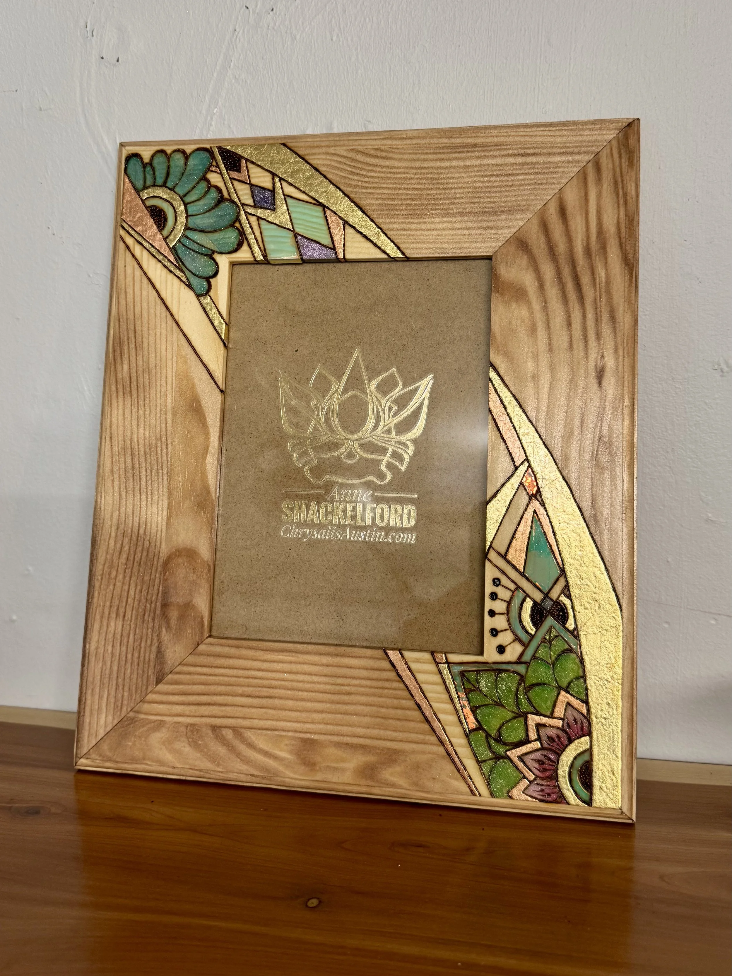 Original pyrography Firelight Frame by Anne Shackelford, detailed wood burned design highlighting natural grain.