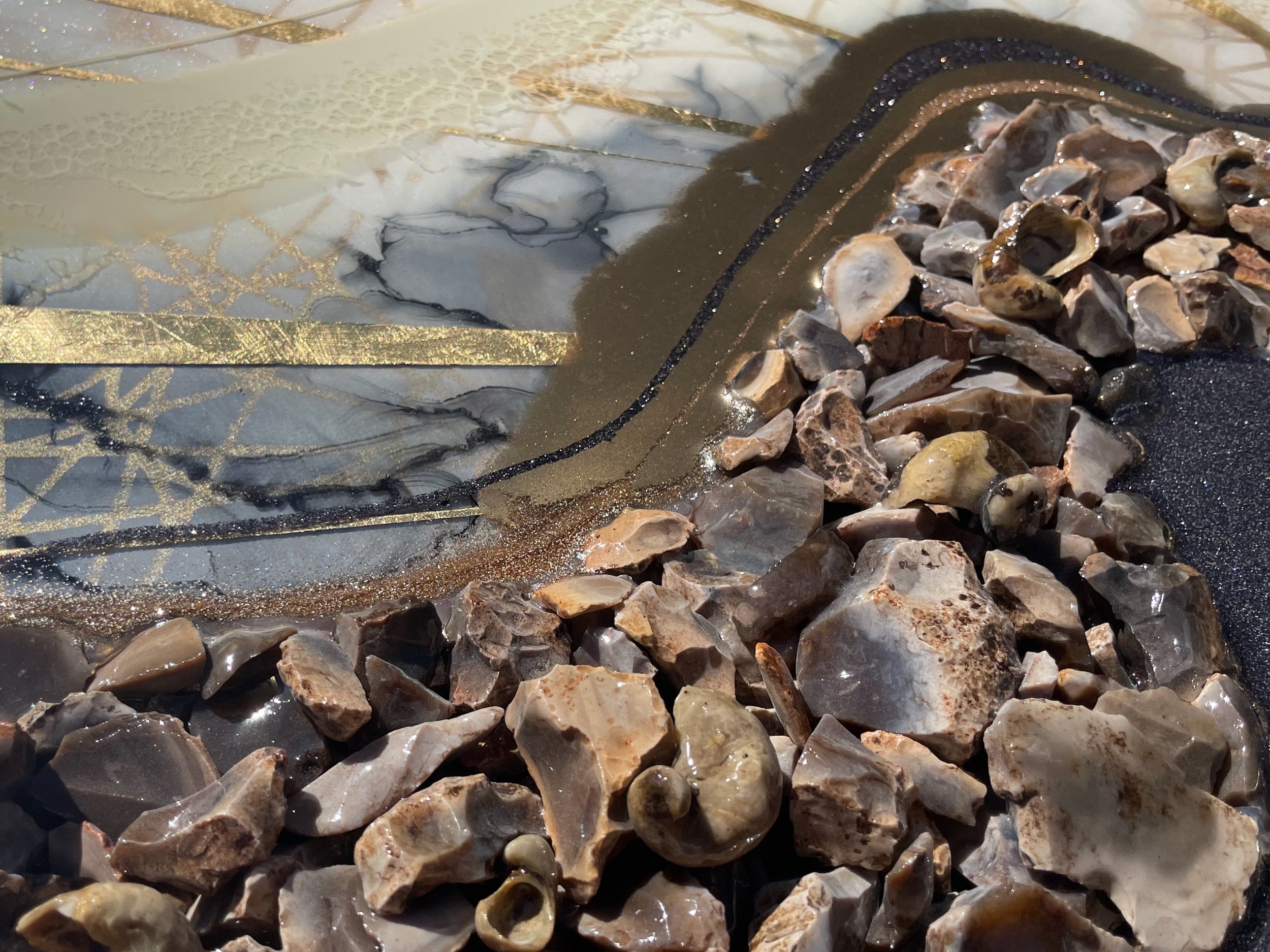 Contemporary wall art by Anne Shackelford created with flint rock, alcohol ink, and gilded accents.