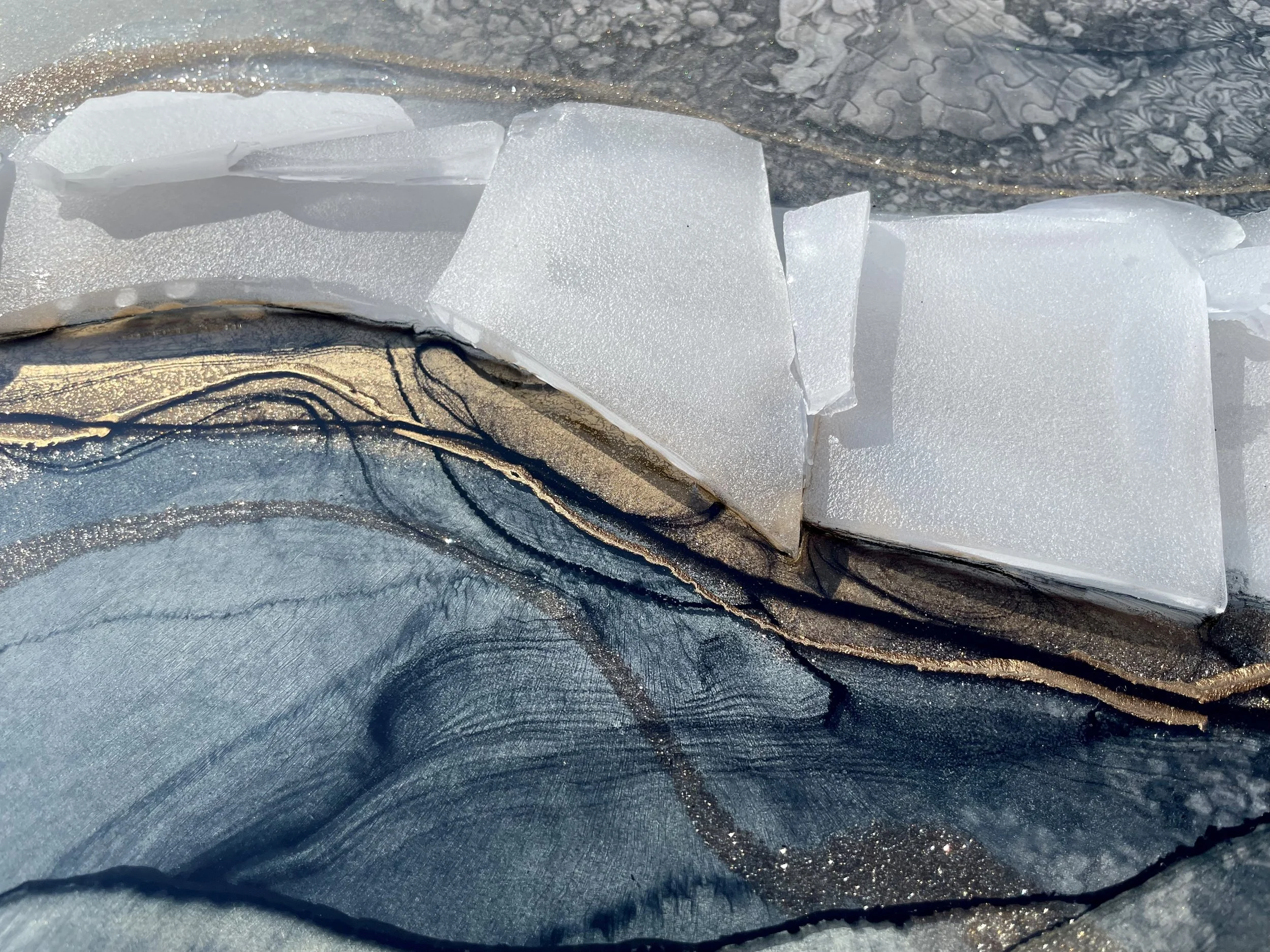 Memory inspired wall art with layered resin and reflective surface