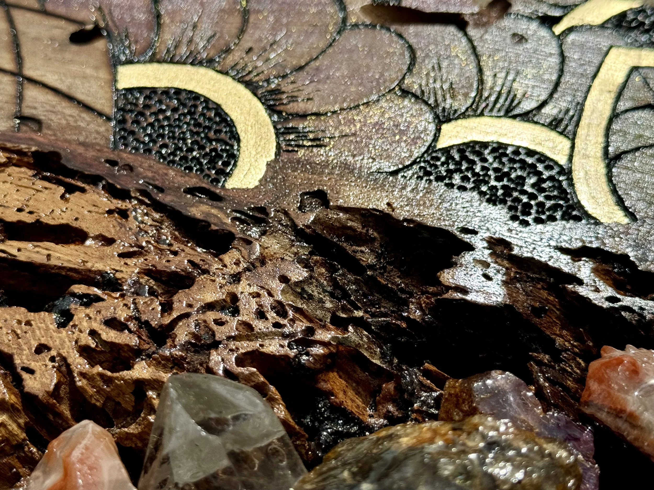 Pyrography wall art accented with metal leaf and ink details