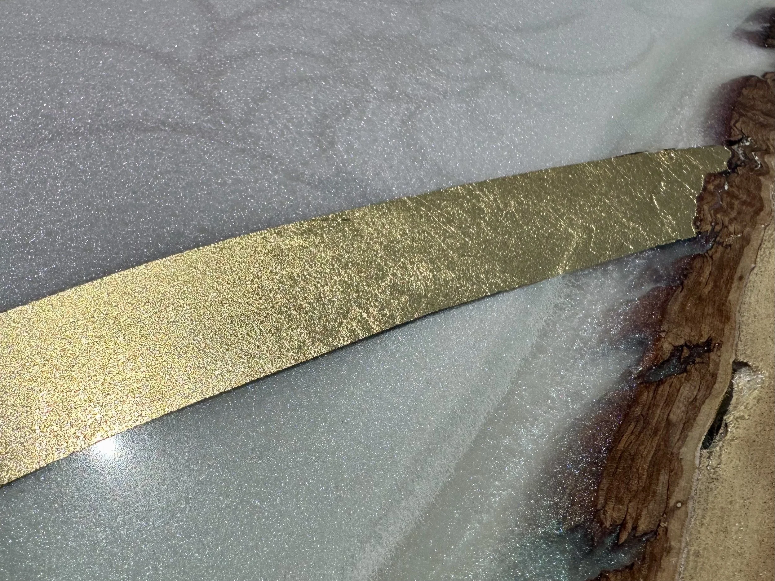 Layered snake wall art created with elemental materials