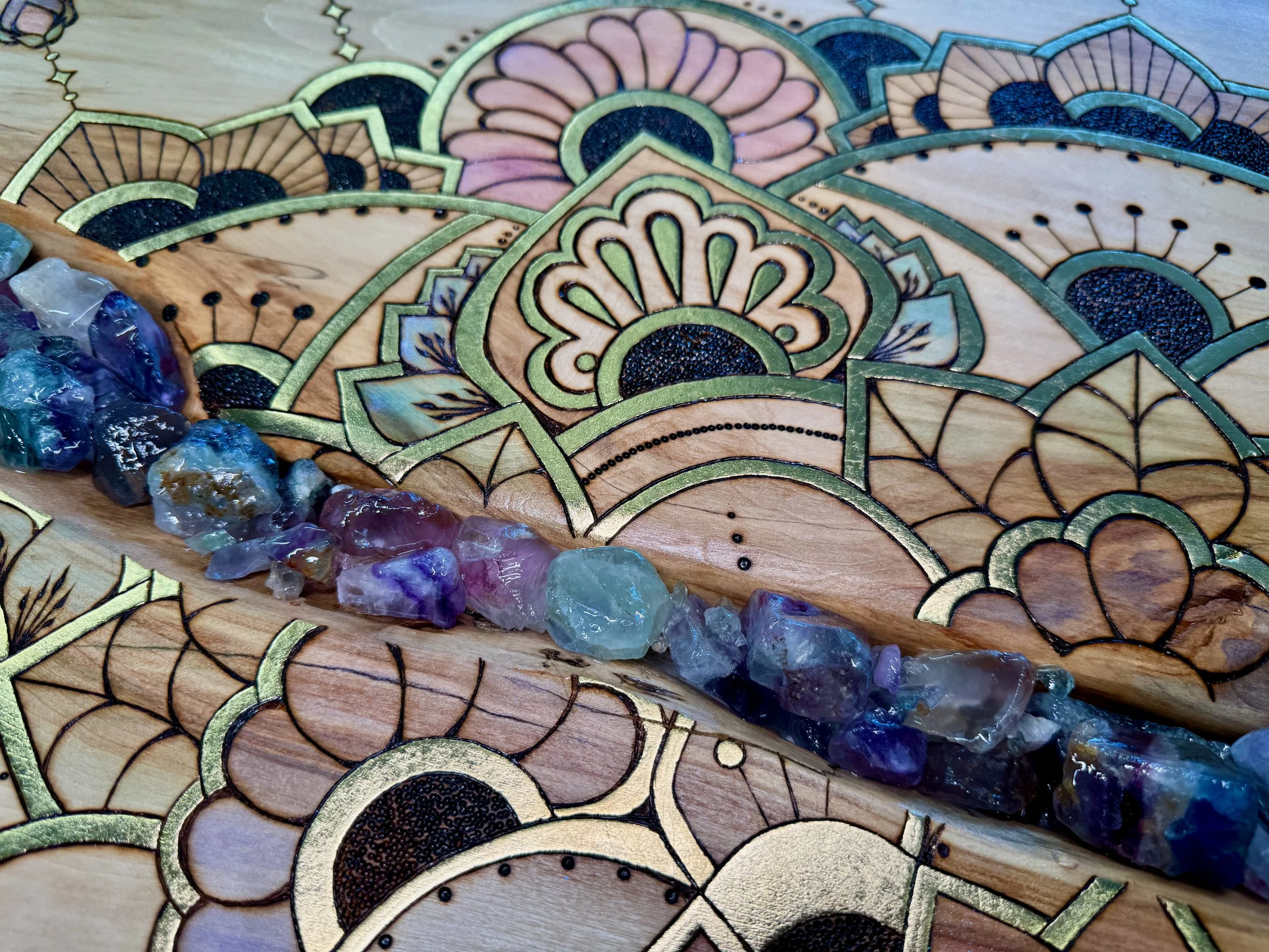 Parivrtta mixed media artwork featuring rainbow calcite, gold leaf, and hand-burned aspen by Anne Shackelford.