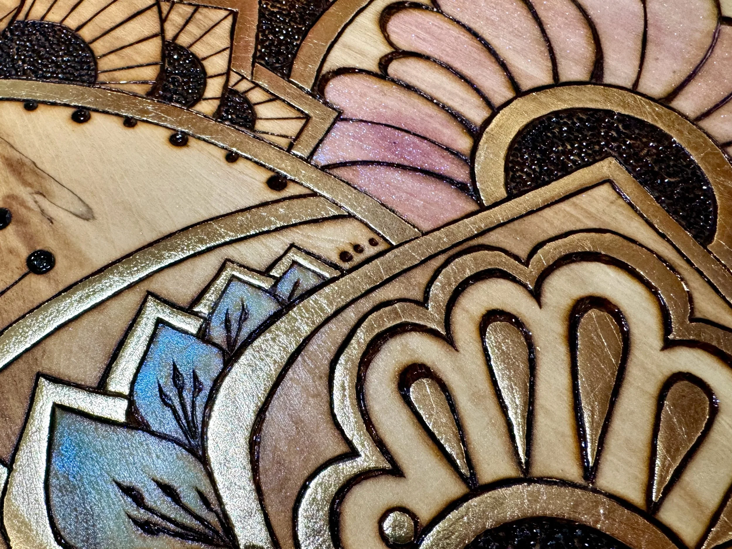 Handcrafted Parivrtta wall art combining wood burning, alcohol ink, and gold leaf by Anne Shackelford.